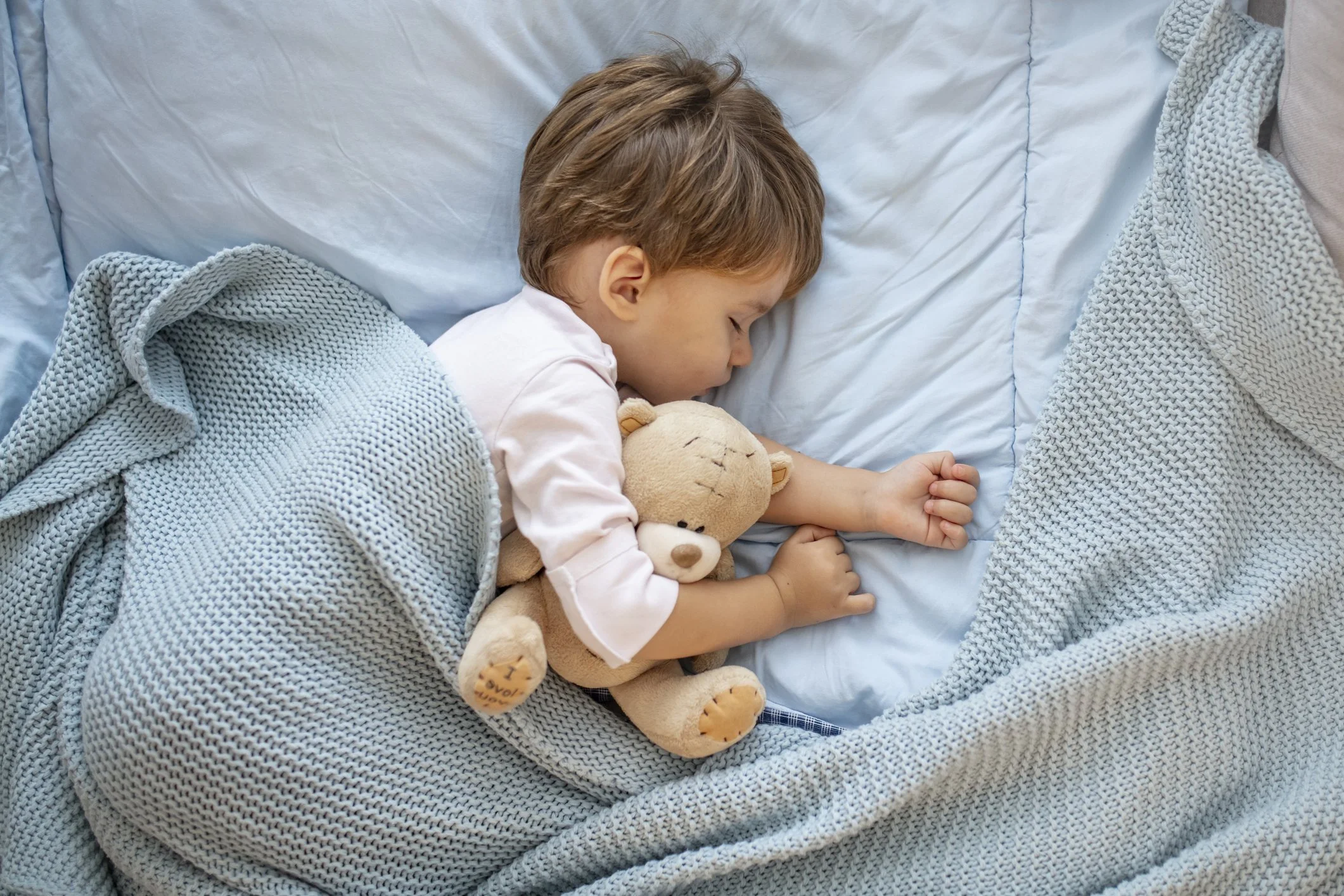 Young Toddler fast asleep, well rested and comfy
