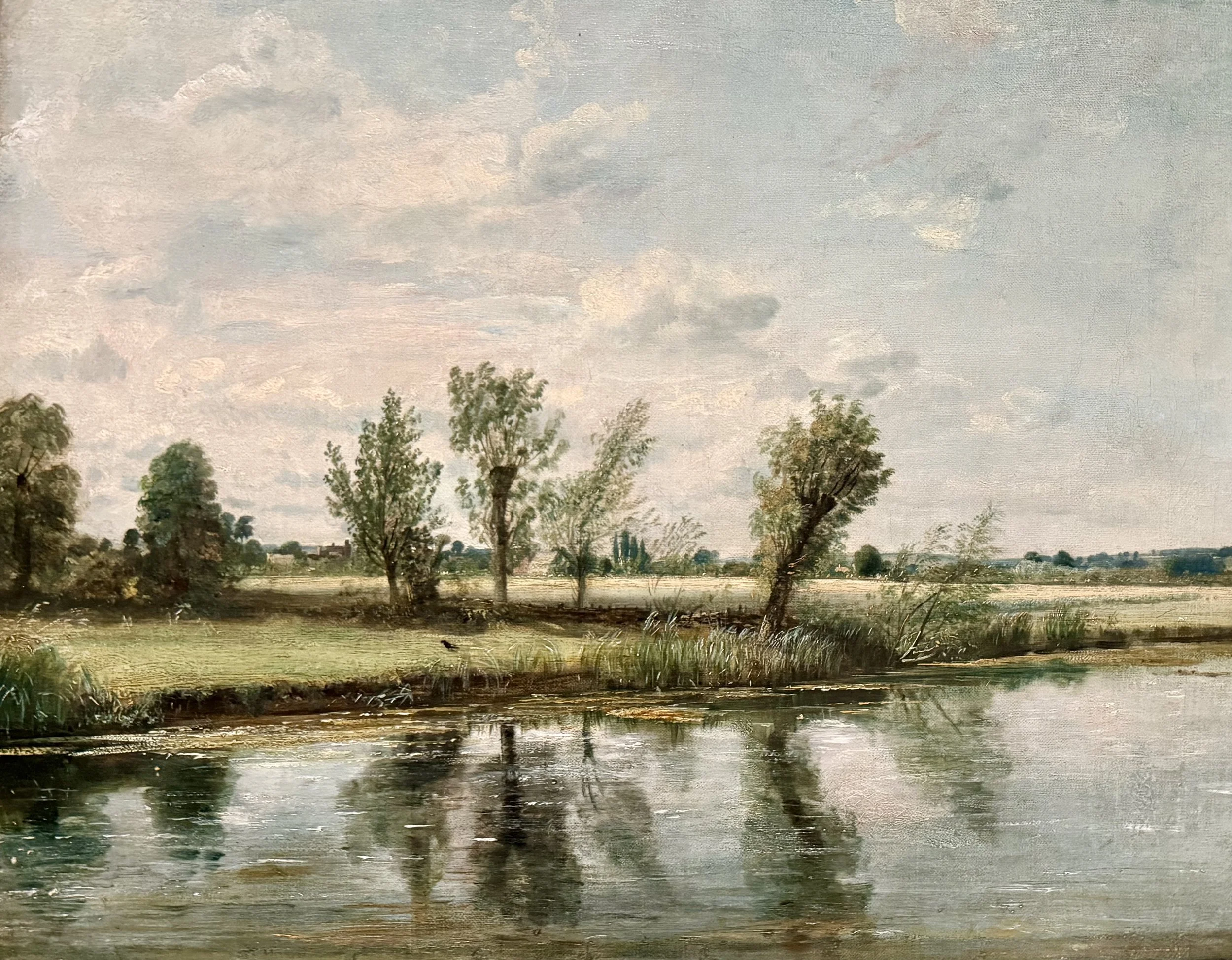 Landscape painting of a river with trees and a cloudy sky.