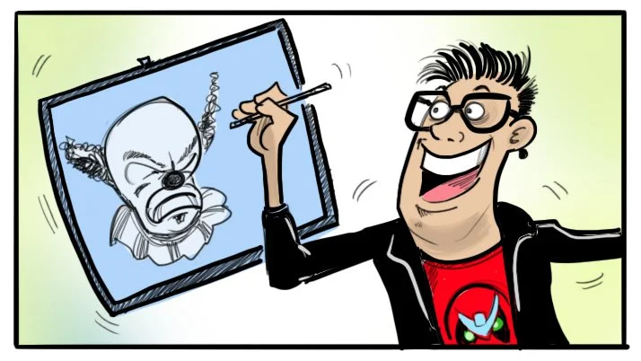 A man with glasses and a red shirt with a cartoon graphic is drawing a clown on a digital drawing tablet.