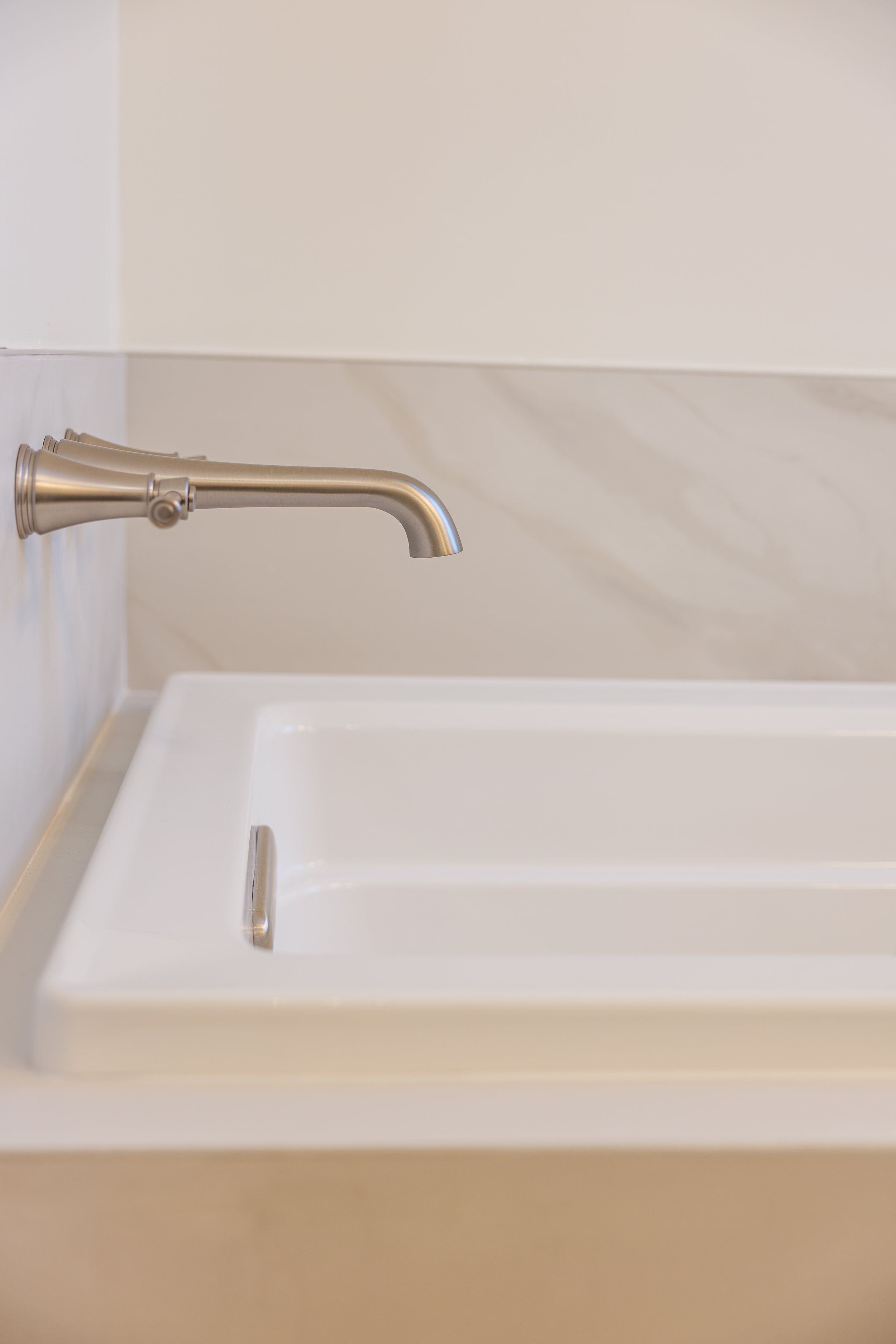 luxury-bathroom-remodel-drop-in-tub-wall-faucet.jpg