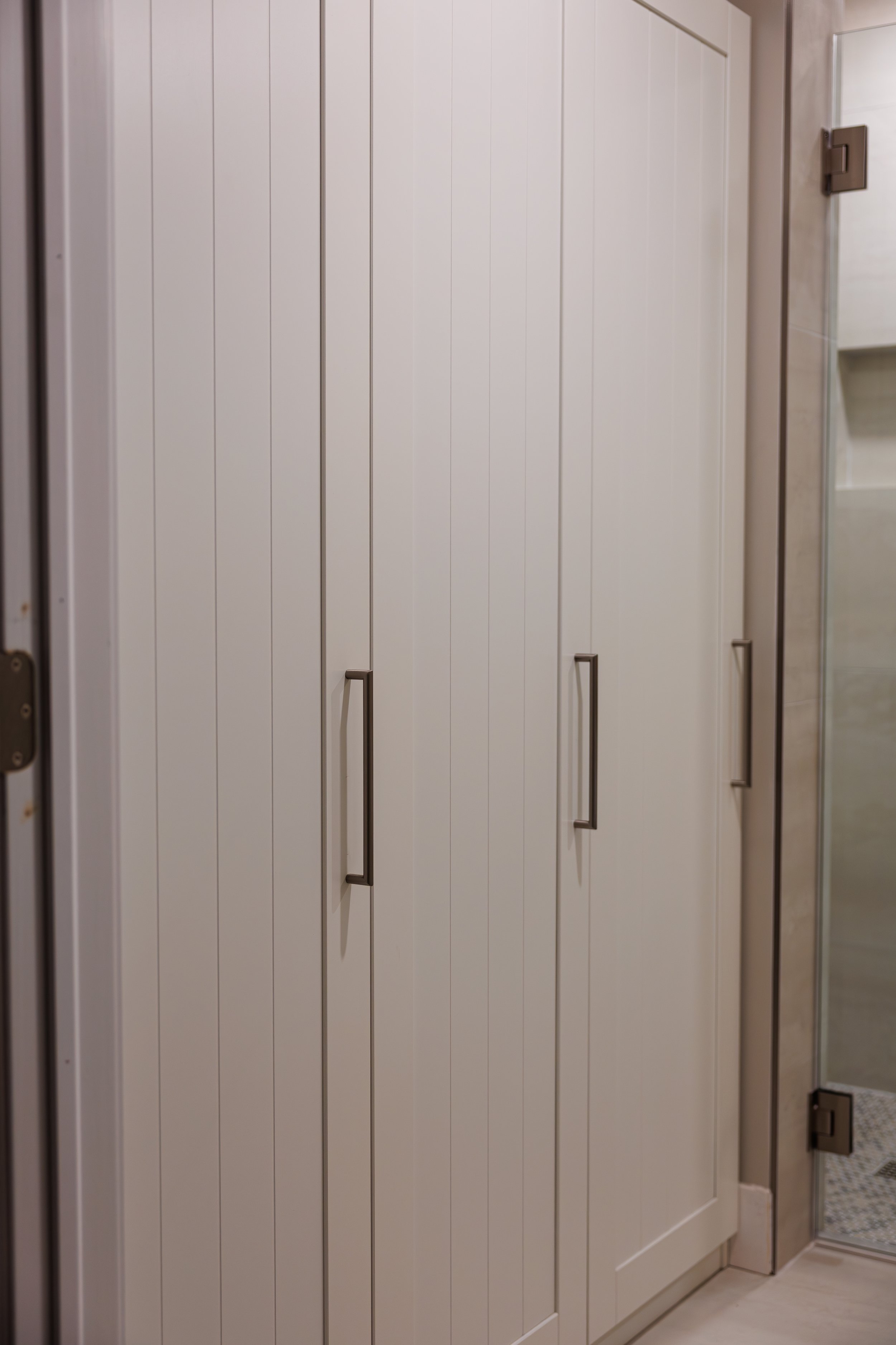 luxury-bathroom-remodel-tall-gray-storage-cabinets.jpg.jpg