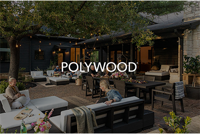 Outdoor patio with seating, tables, string lights, and people dining under trees.