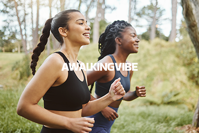 Two women jogging outdoors in a park with trees and grass, smiling and enjoying exercise, with the words 'AWAKING VIBE' overlaid.