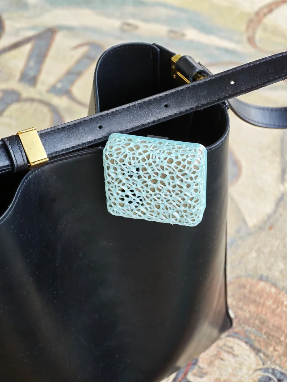 The Skyly air-quality sensor prototype clipped to a bag