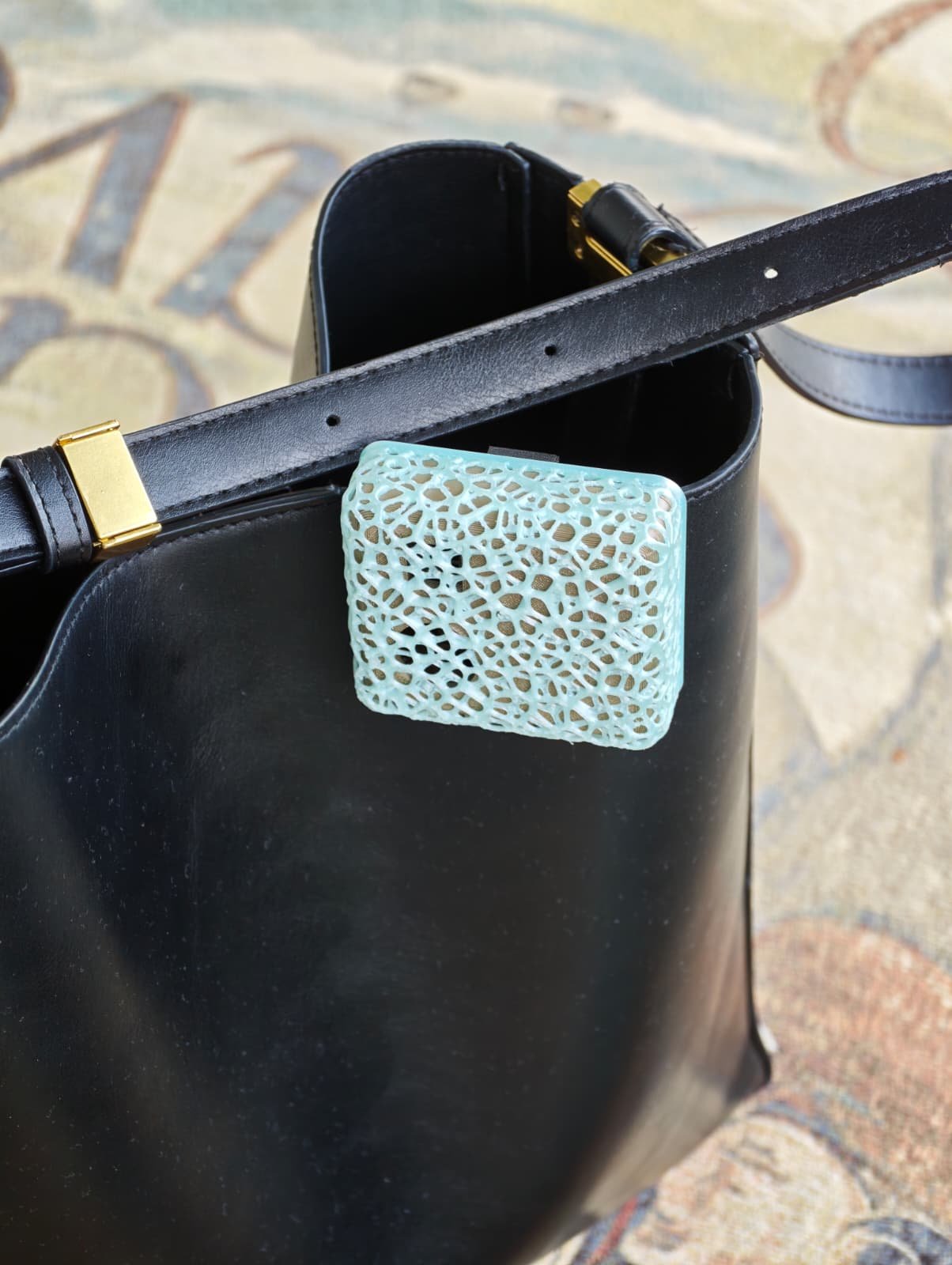 Skyly prototype clipped to a bag