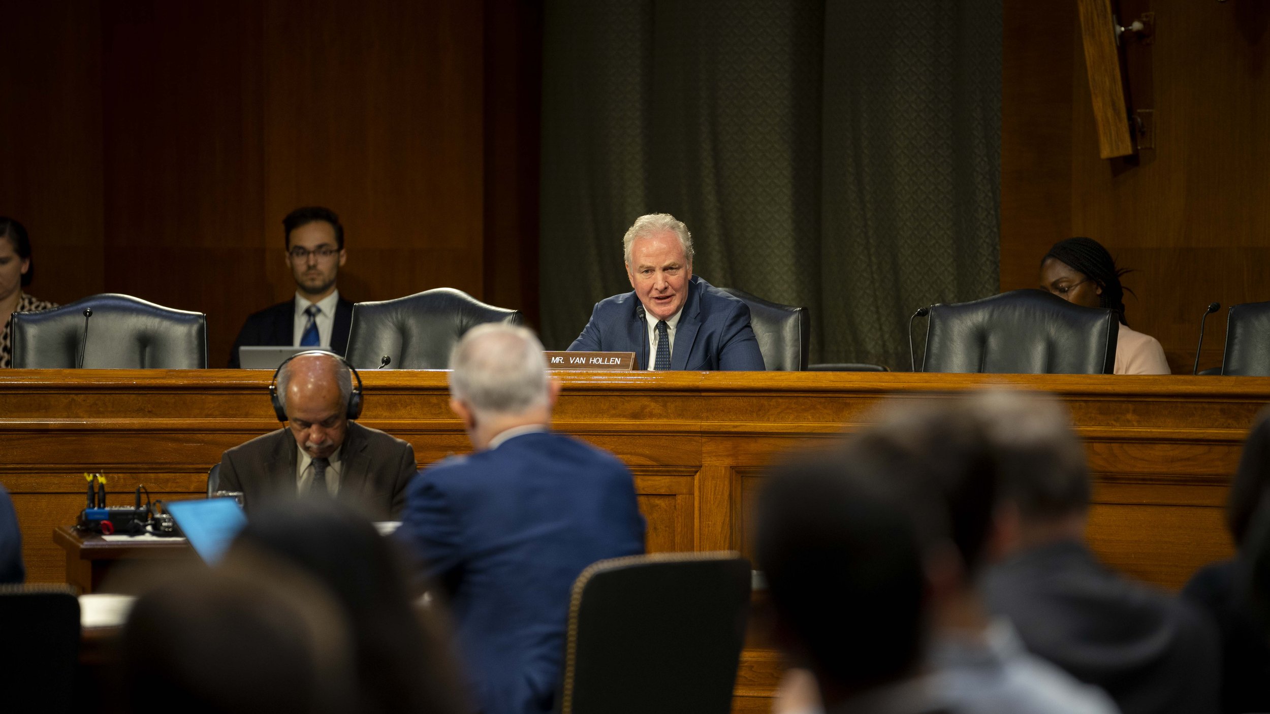 Senator Chris Van Hollen questions a witness at a hearing.