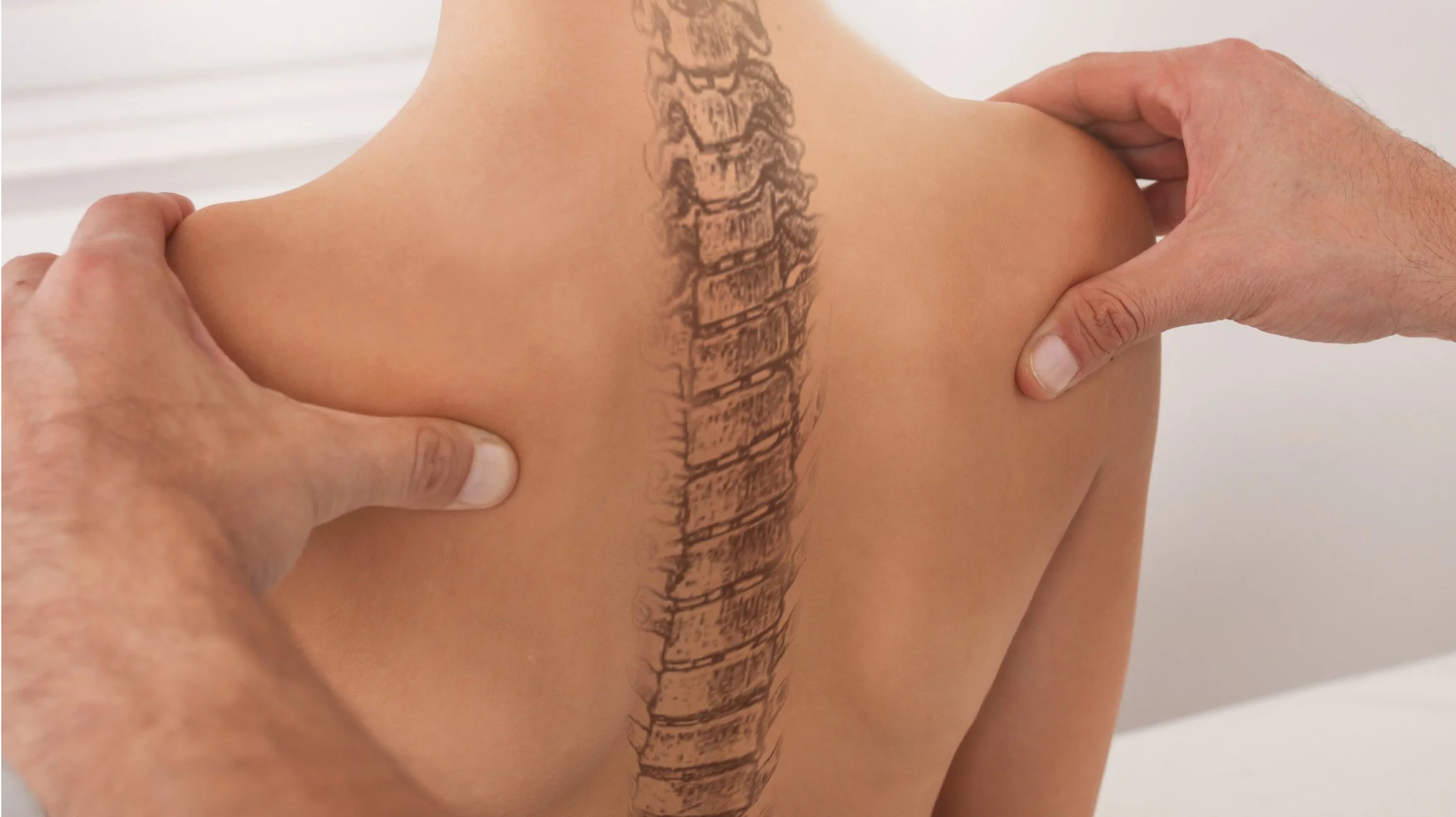 a human back is outlined with a tattoo of vertebrae at CranioSacral Nashville