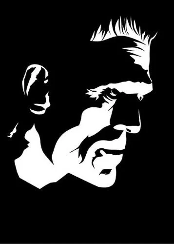 Black and white silhouette of a man's face in profile with short hair.