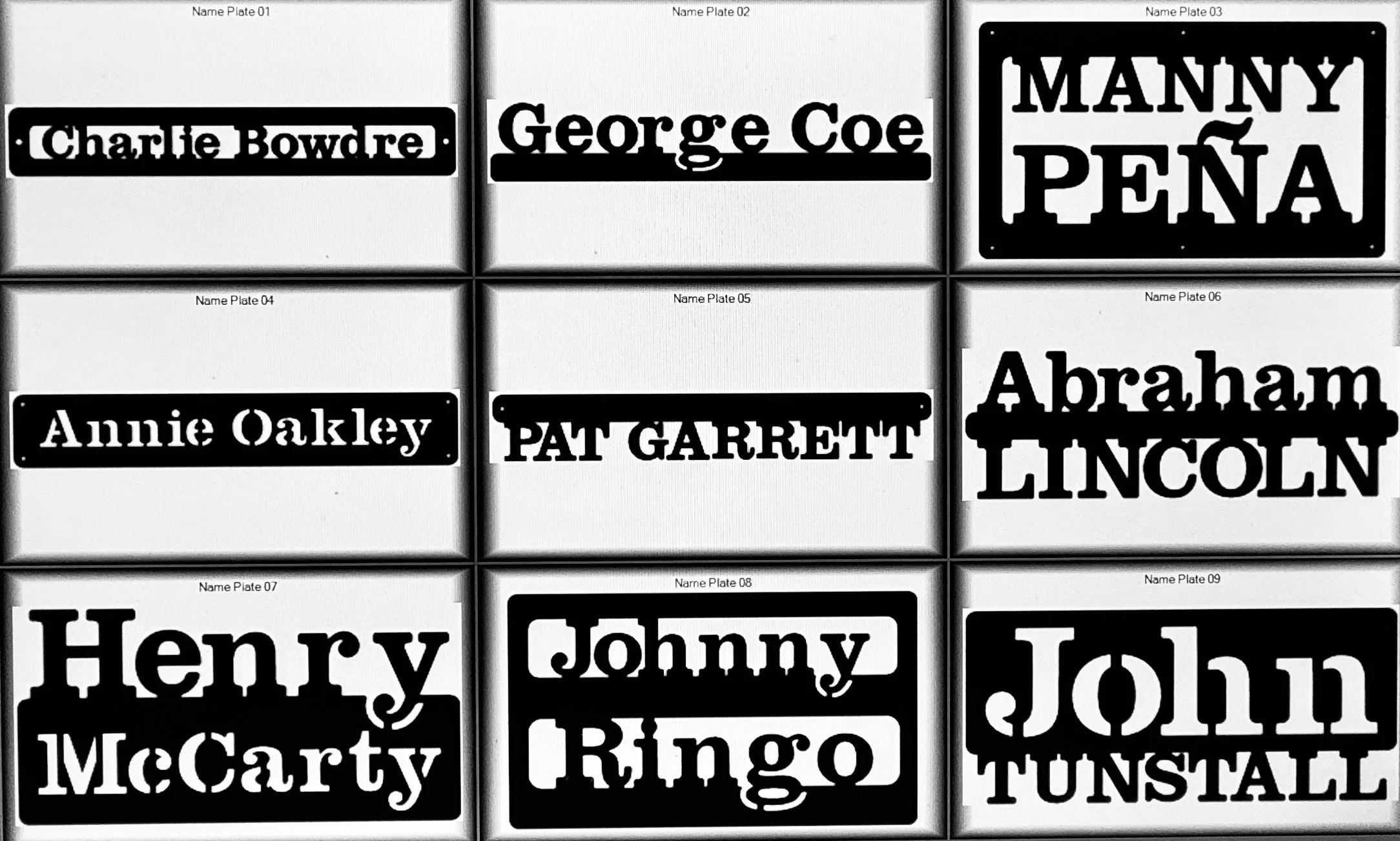 Collection of black and white name plates with various personal names, arranged in a grid.