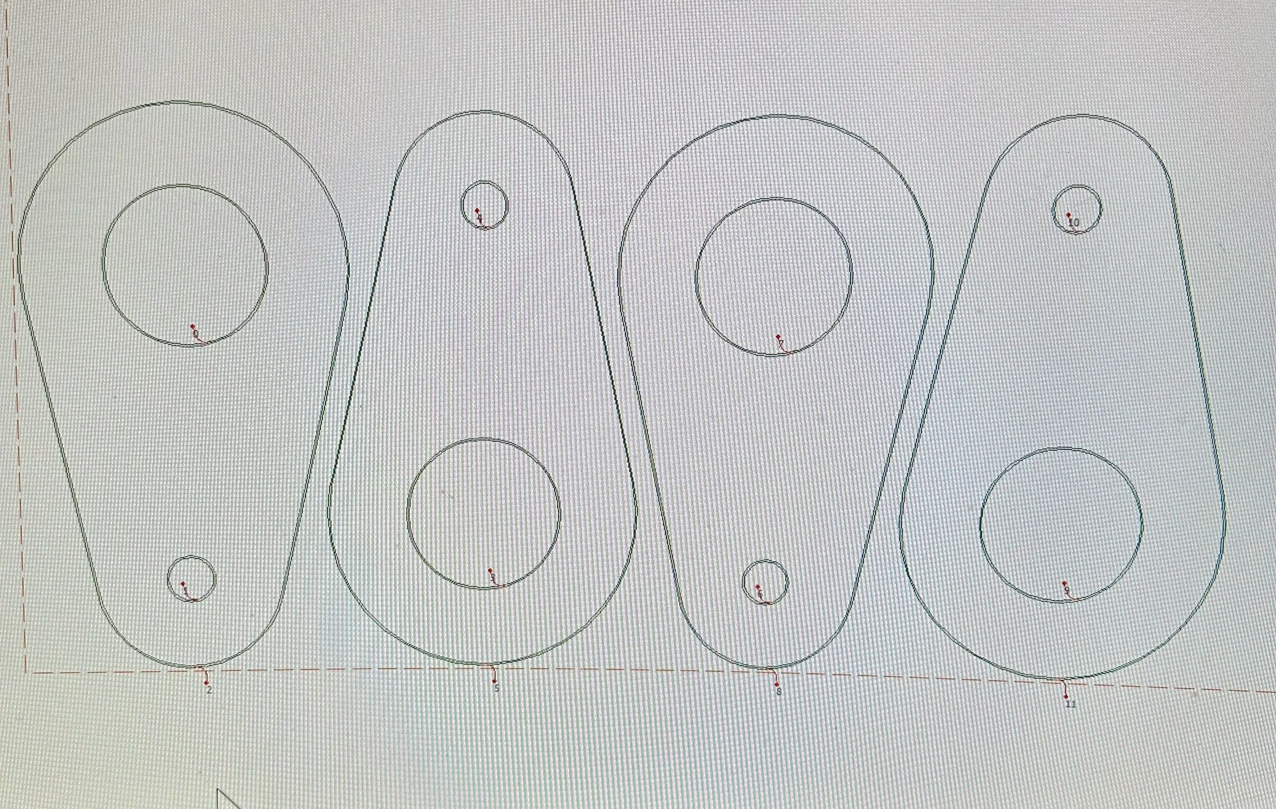 A computer screen displaying a technical drawing or blueprint with multiple concentric and interconnected oval shapes, some marked with small red numbers.