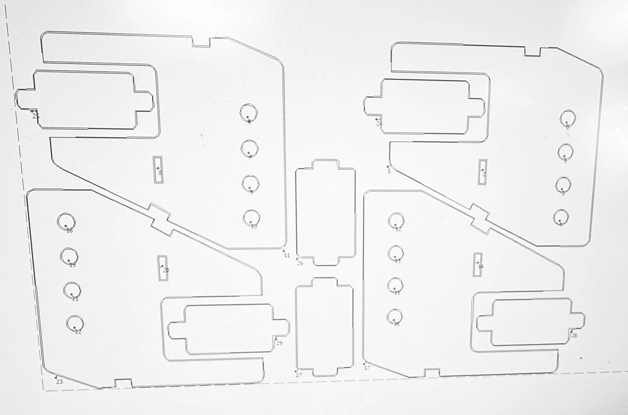 A technical blueprint or architectural floor plan with multiple rooms, walls, and circular symbols representing features or fixtures.