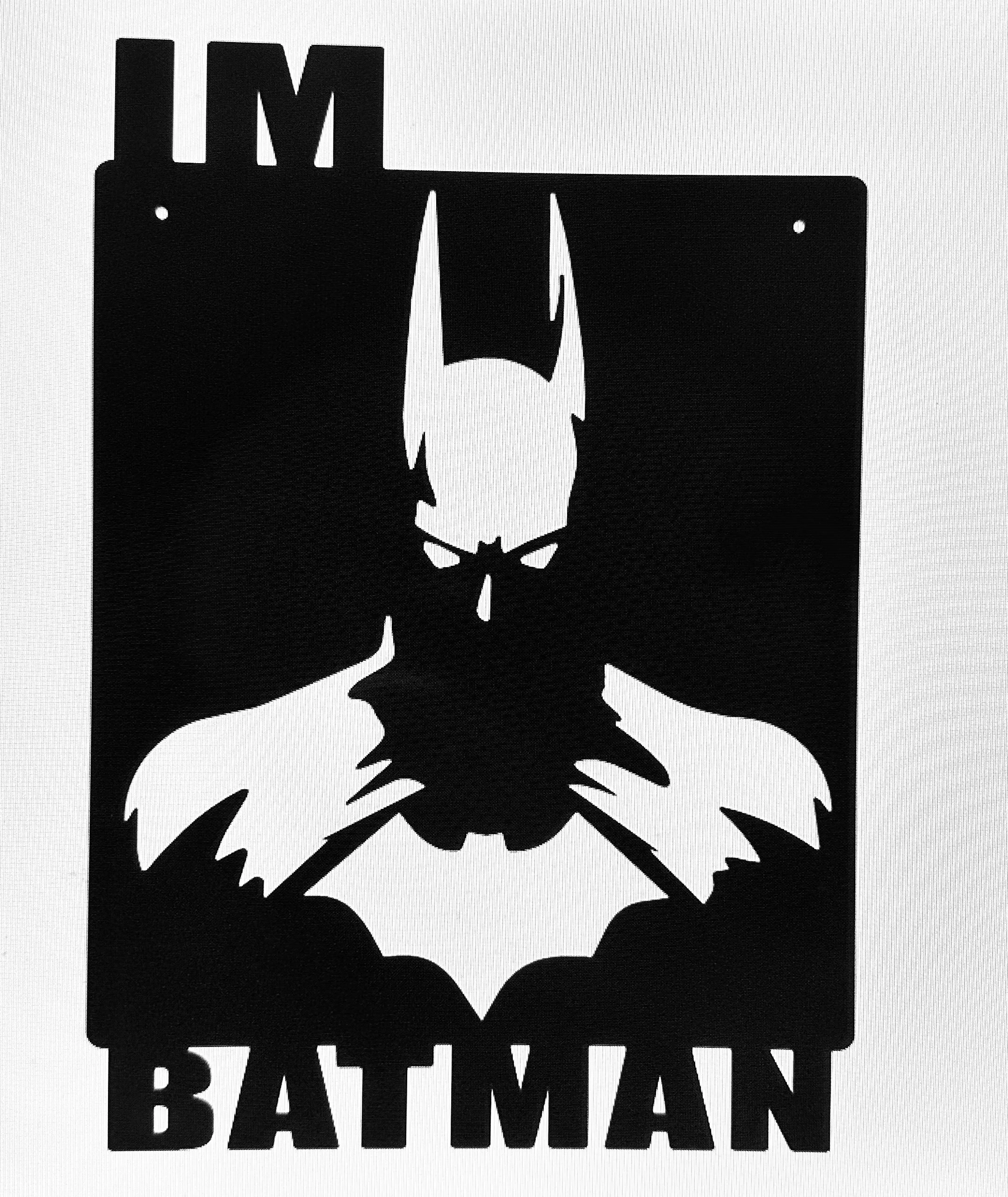 Silhouette of Batman's face with the text 'I'M BATMAN' above and below the logo.