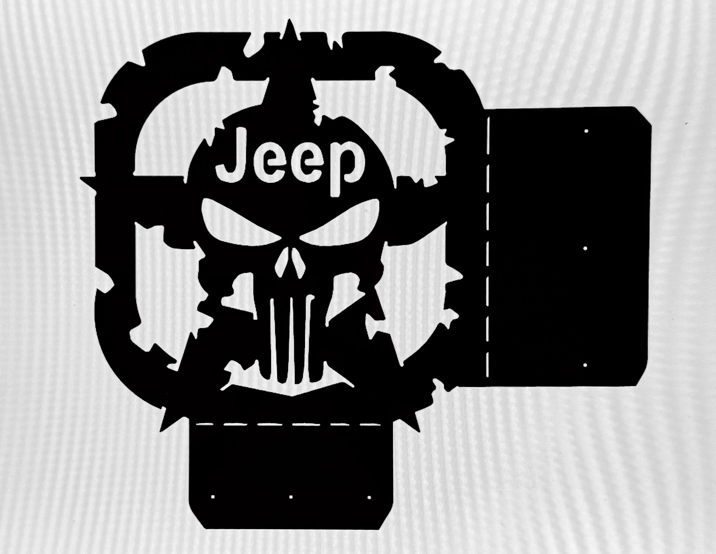 A black silhouette of a skull with a Jeep logo in the center. The skull has a spiked band around its forehead, and there are spokes from the skull's mouth.