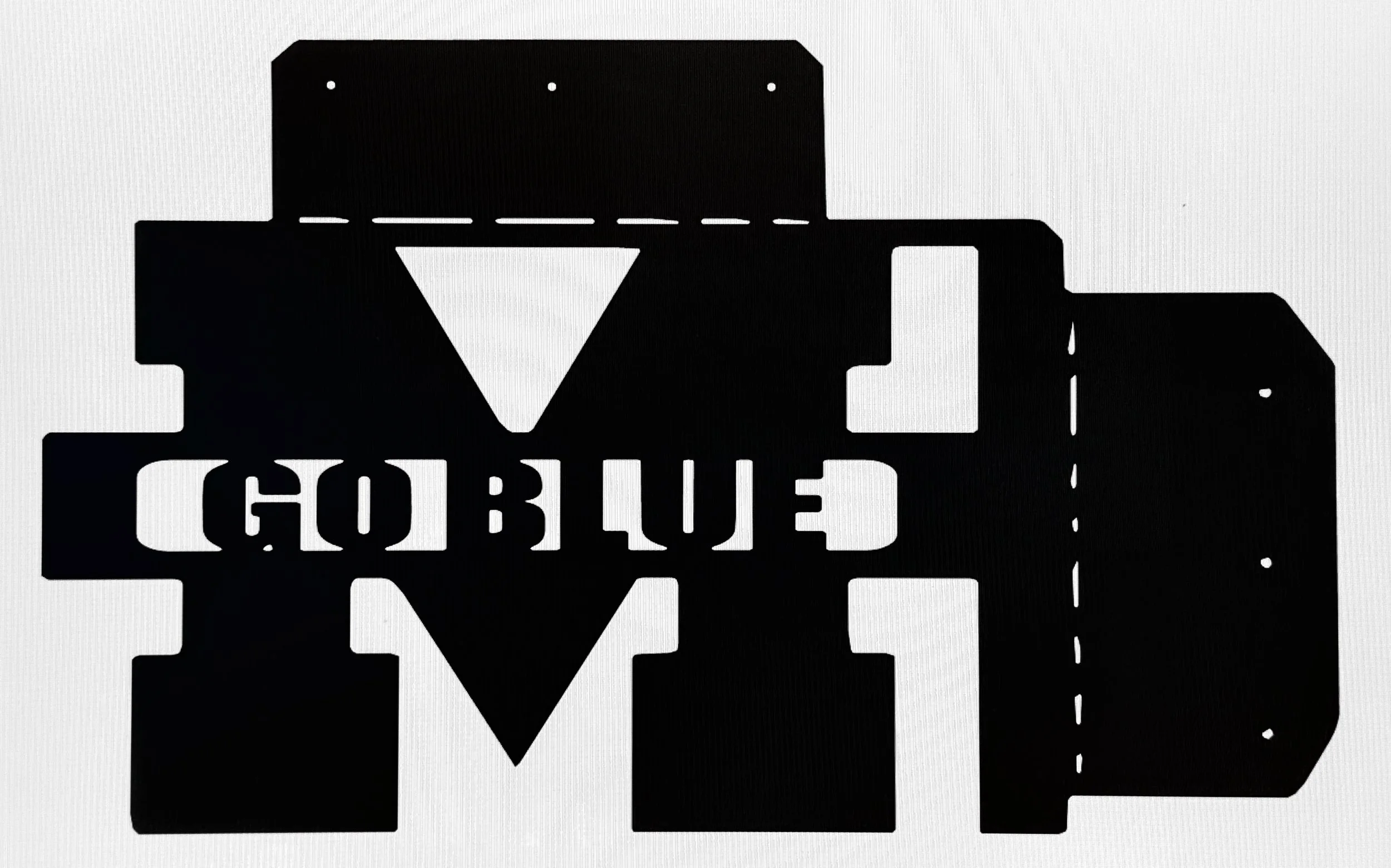 A black stencil-style cutout of a car with the license plate reading 'GOBLUE' and a triangle symbol in the center.