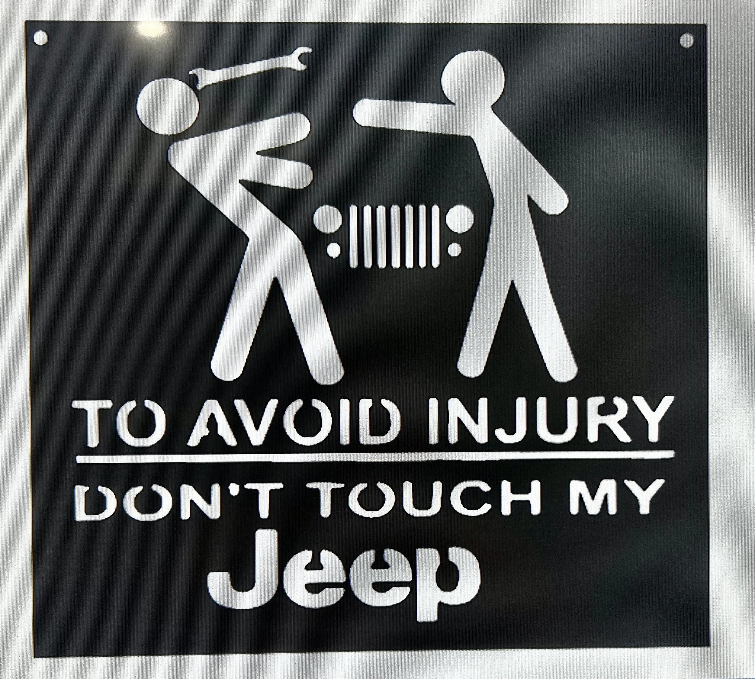 A black warning sign with white icons and text reading 'TO AVOID INJURY, DON'T TOUCH MY' with an illustration of two stylized human figures, one handing a wrench to the other.