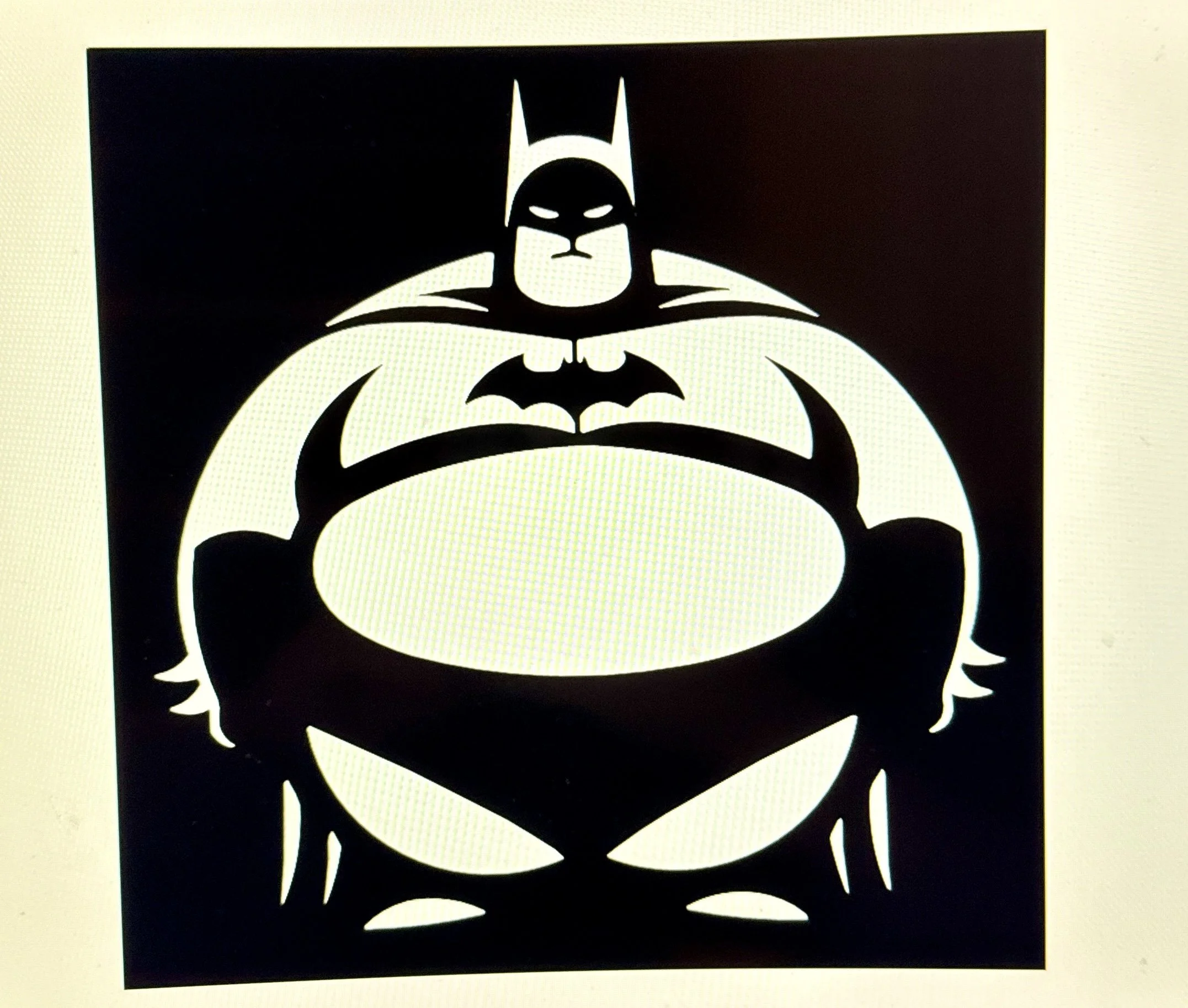Black and white stencil art of Batman's face and bat symbol with a black background.