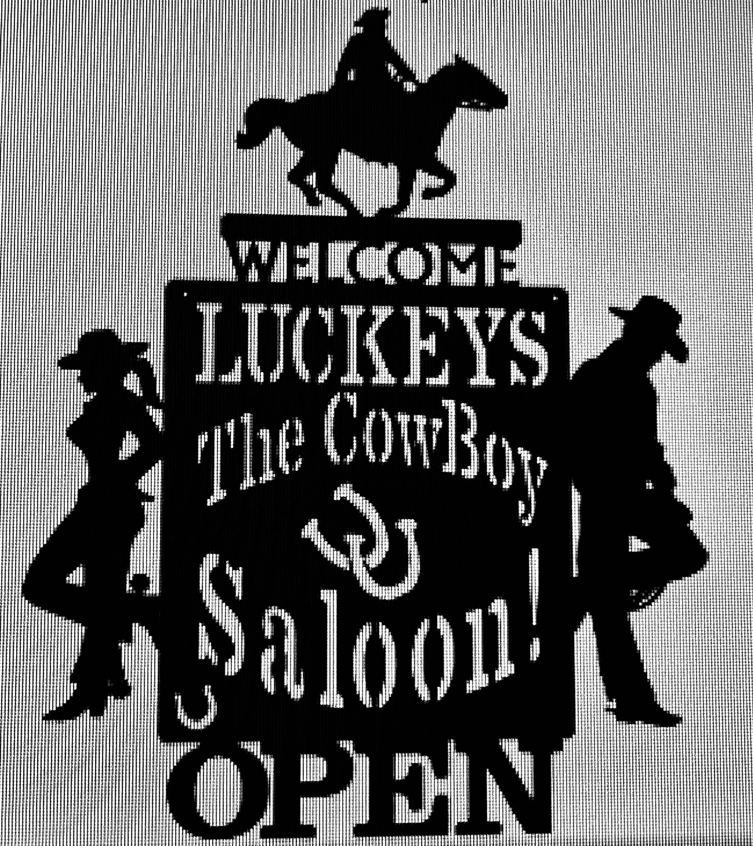Silhouette of a dog riding a bicycle beneath a sign that reads "Welcome Buckeyes".