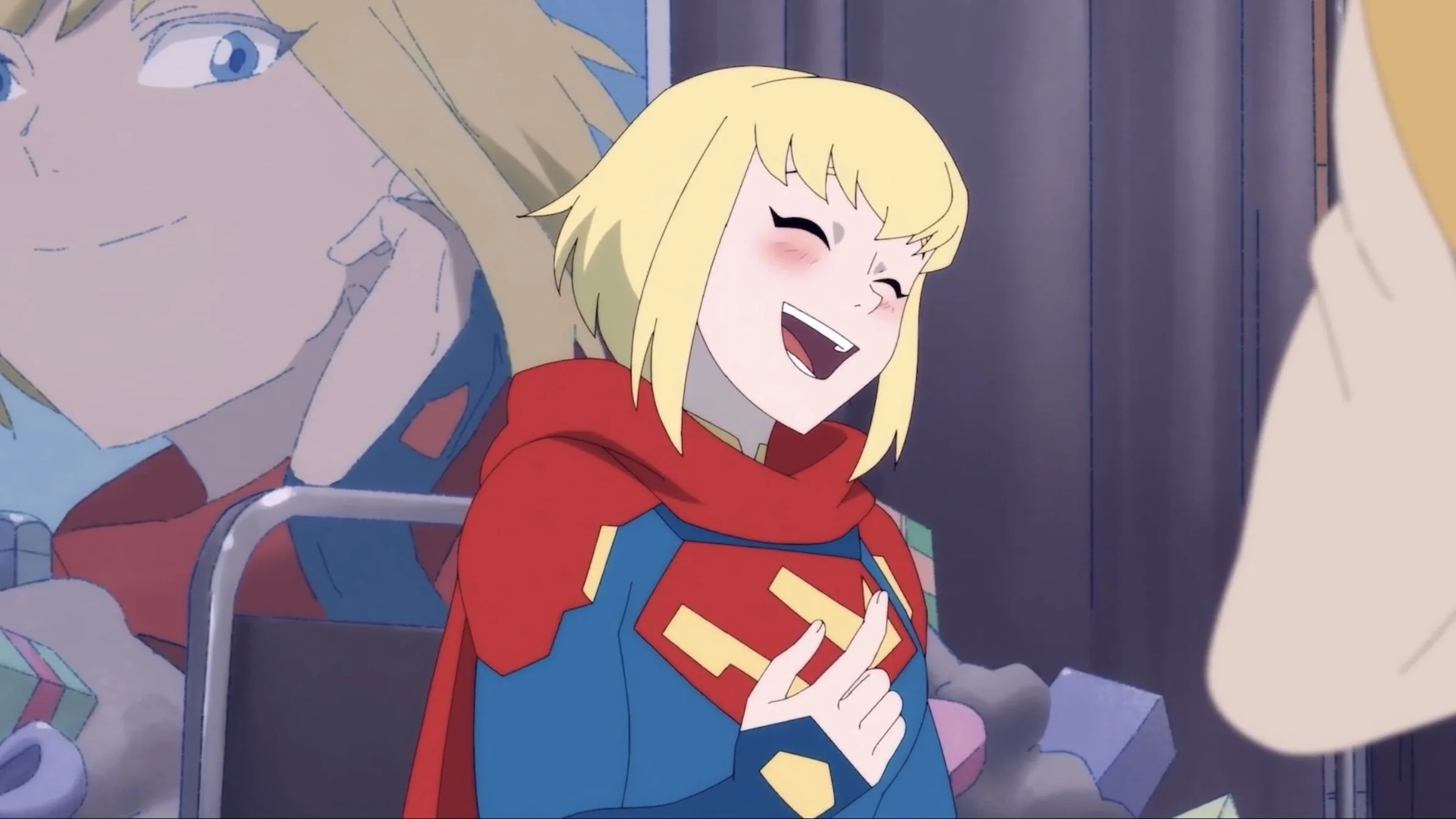 A screen grab from the series showing Kara blushing and with a huge smile on her face.
