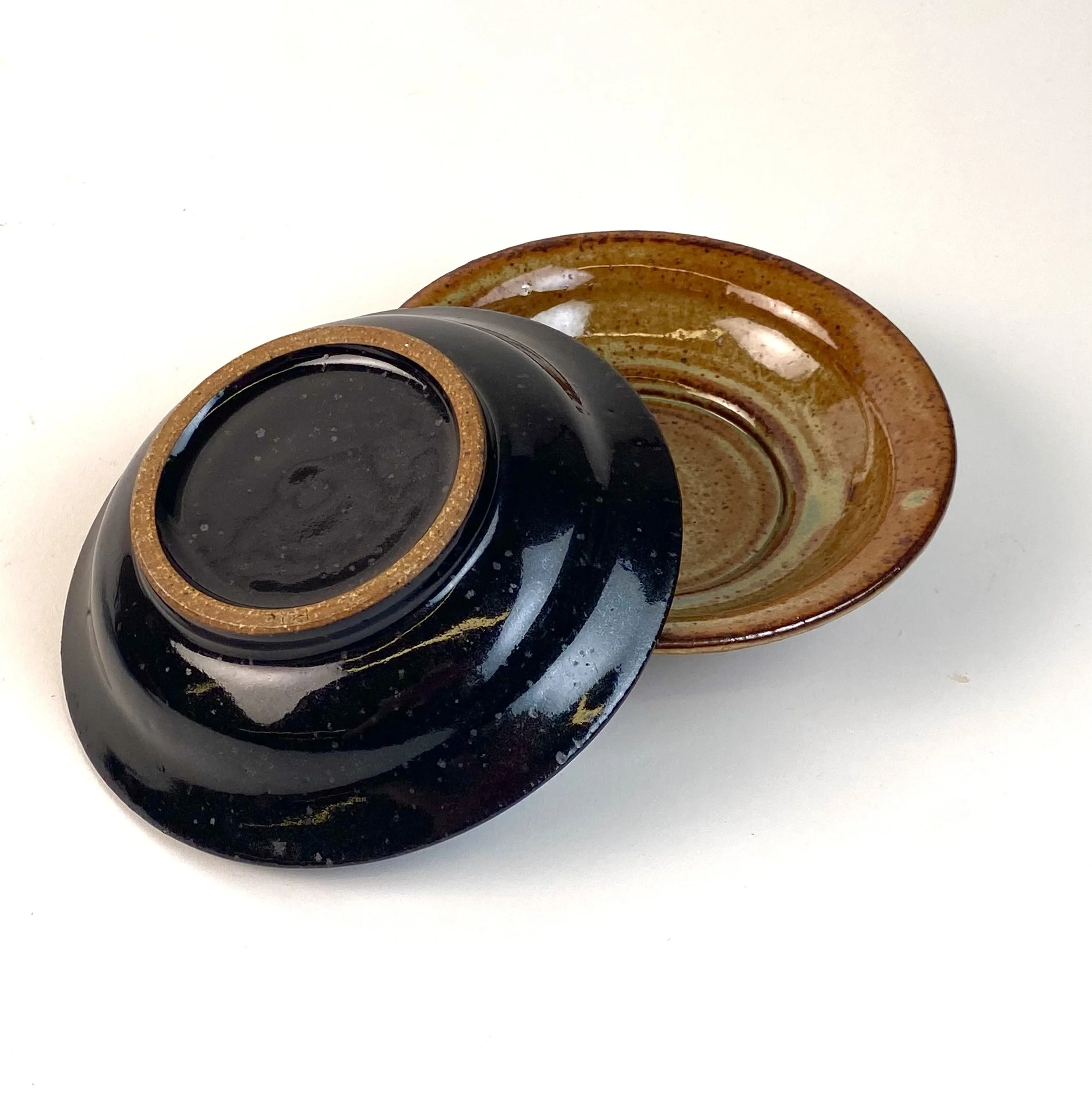 Series of Side Dishes (Copy), 5½" in width, recycled clay, △10 gas reduction, mirror black and woo blue over grey shino, 2025