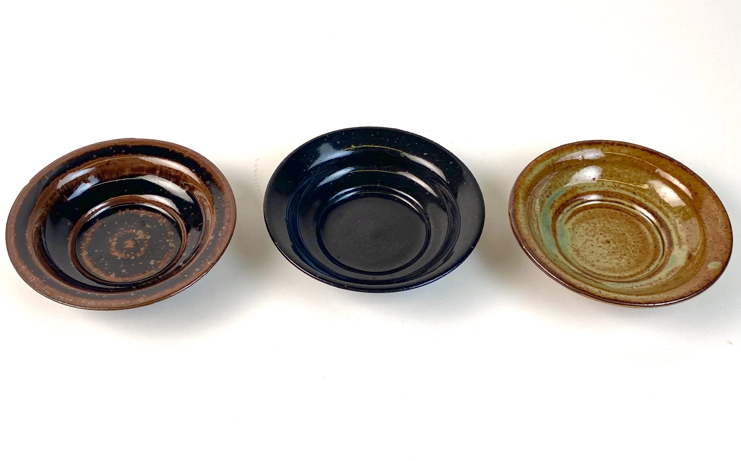 Series of Side Dishes (Copy), 5½" in width, recycled clay, △10 gas reduction, mirror black and tenmoku and woo blue over grey shino, 2025