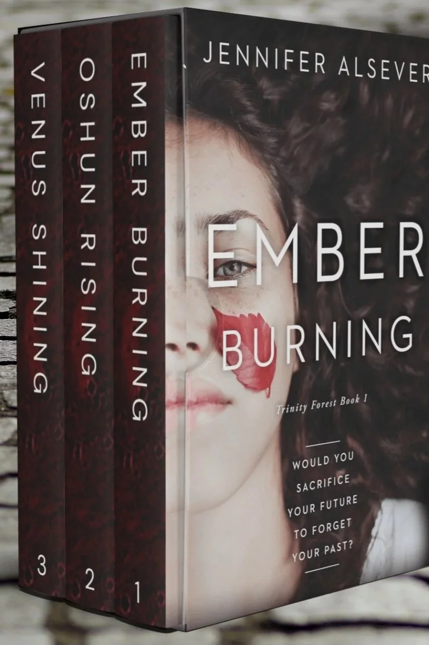 A set of four books titled 'Ember Burning' by Jennifer Alsever, part of the Trinity Forest series, displayed with a partial cover showing a young woman with curly hair and a red leaf on her face.