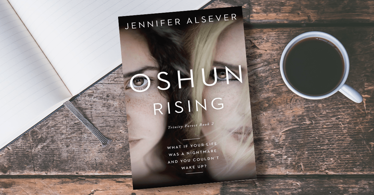 A book titled 'Oshun Rising' by Jennifer Elsever on a wooden table, with an open notebook and a cup of coffee next to it.