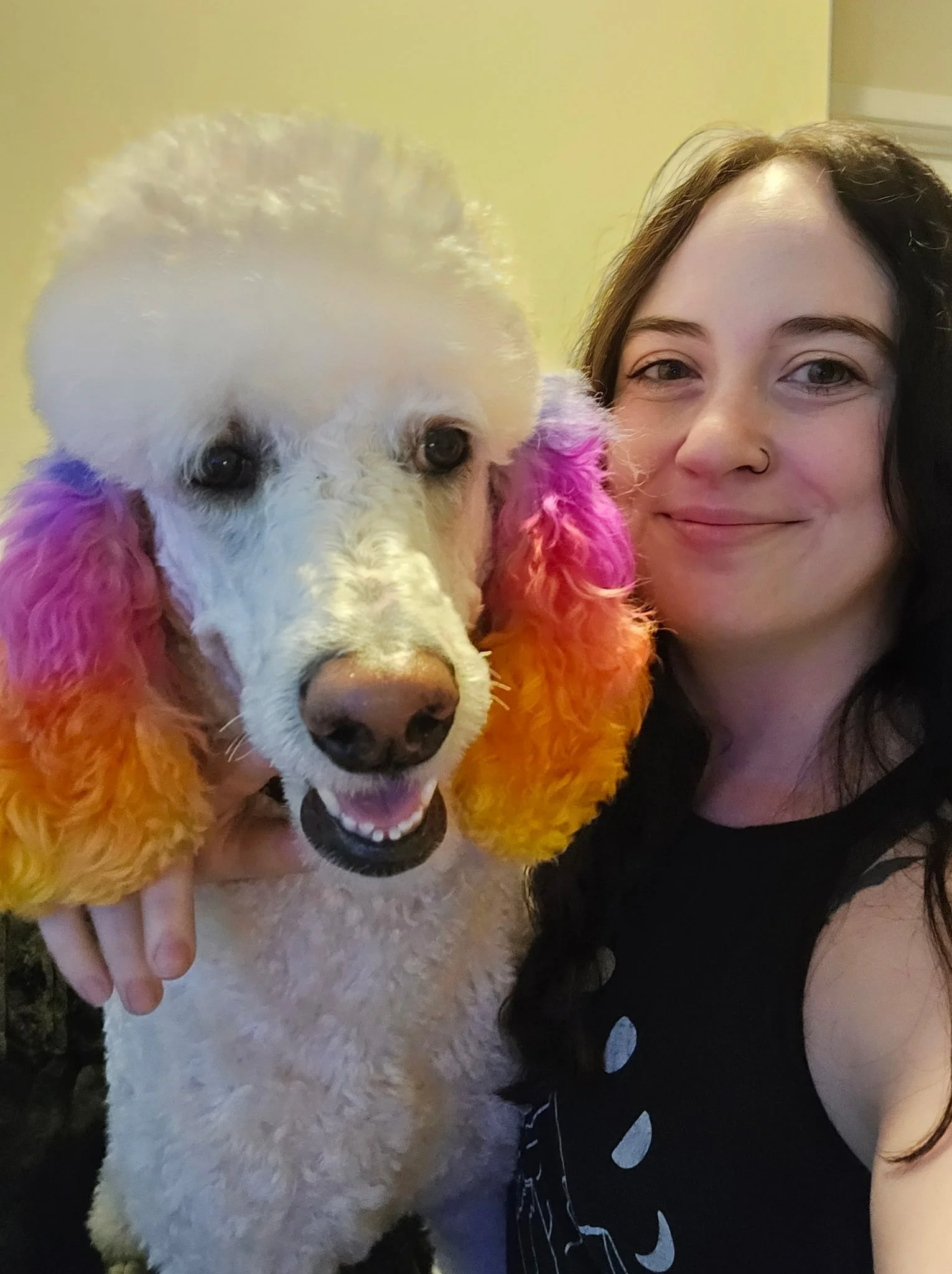 Riki hugging her beloved Standard Poodle