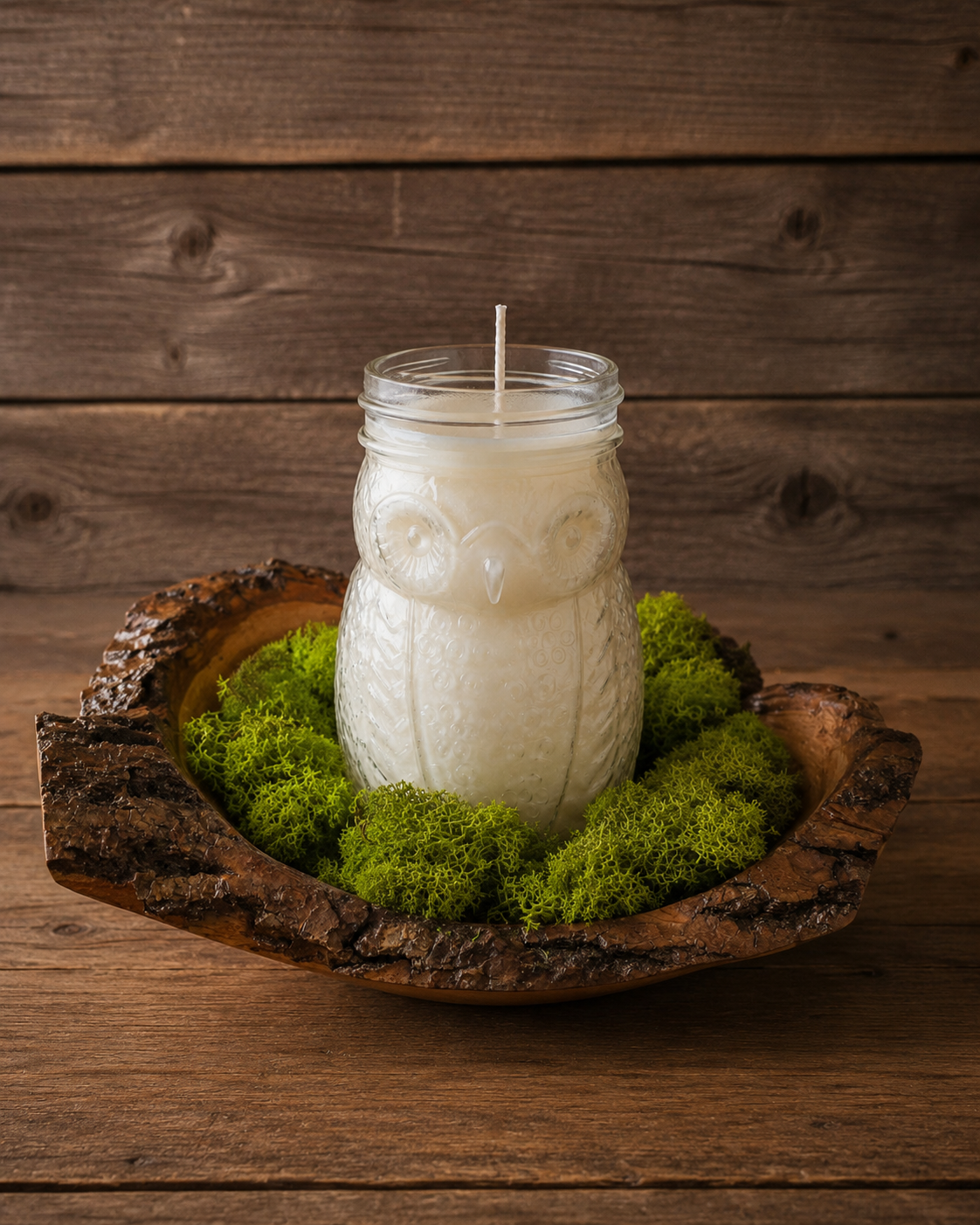 Forest Hearth Owl Candle Display

Inspired by the quiet beauty of the forest, this handcrafted display features a 16 oz owl-shaped candle nestled in a rustic wooden bowl surrounded by a soft moss nest. Hand-poured in a creamy blend of soy wax and par