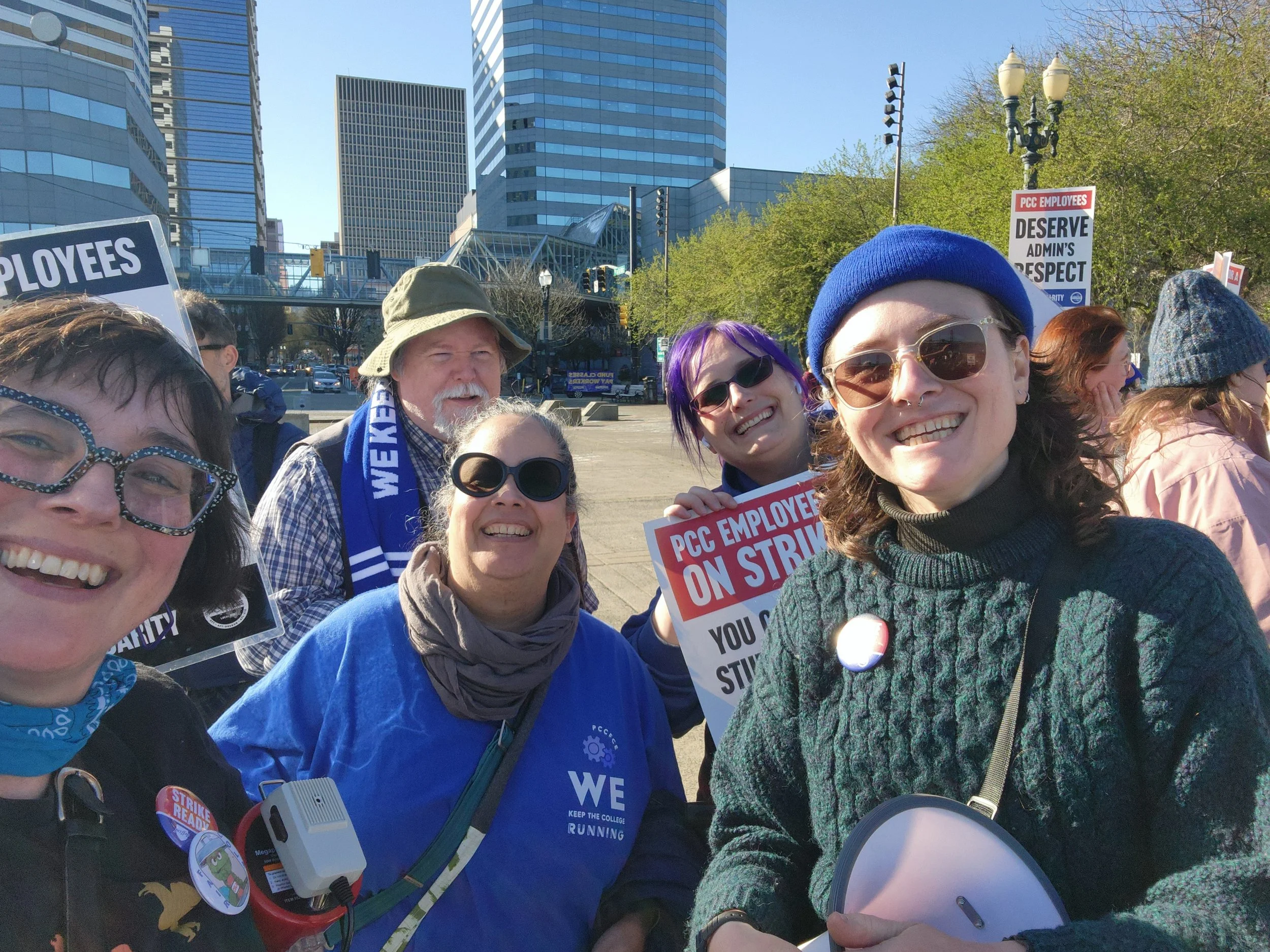Group photo of Aenghus with FCE strike crew at the downtown rally.