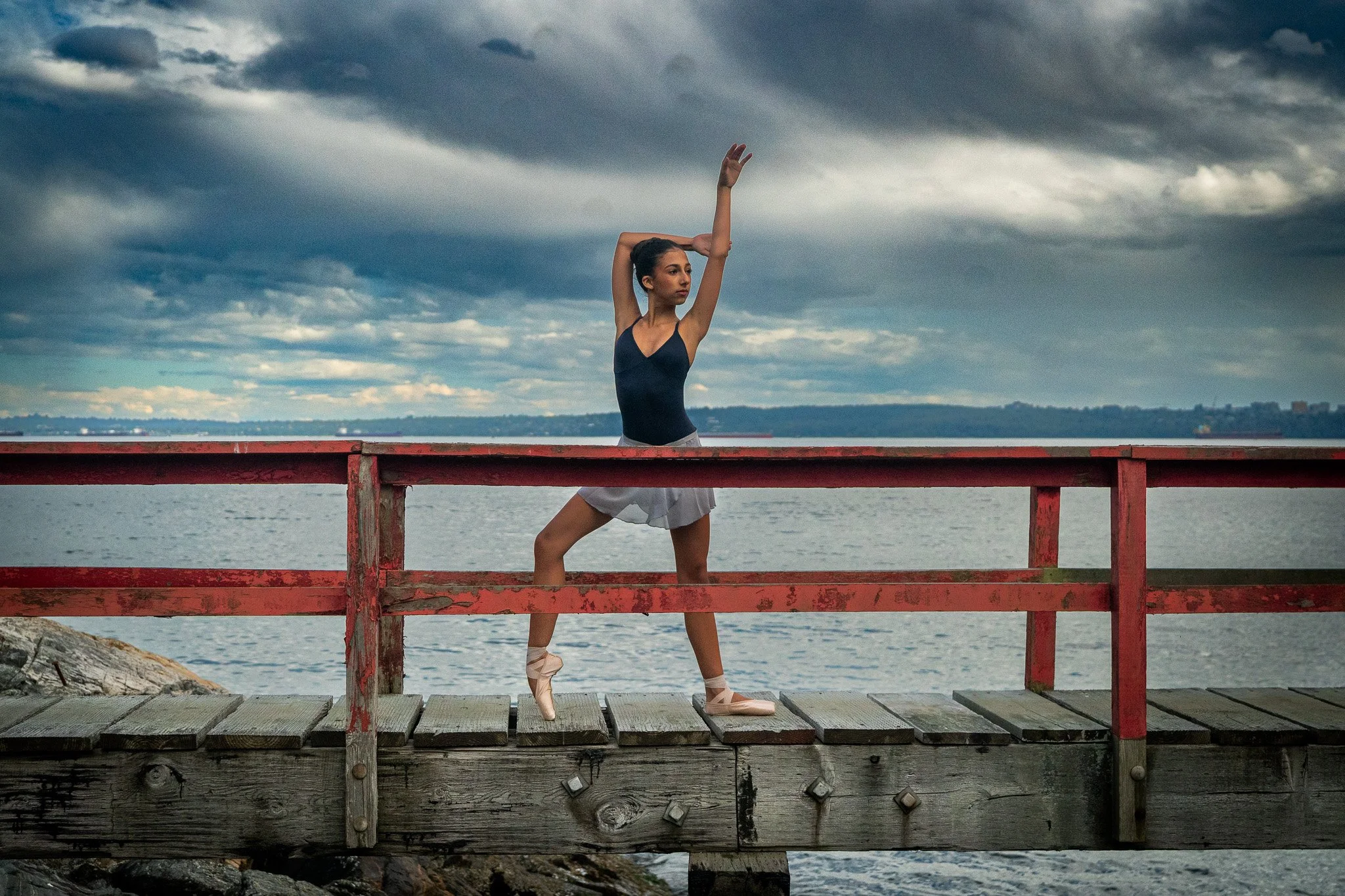Prefontaine Ballet student performing pointework outdoors on the Vancouver waterfront, representing classical ballet training for dancers in North Vancouver, West Vancouver and Vancouver.