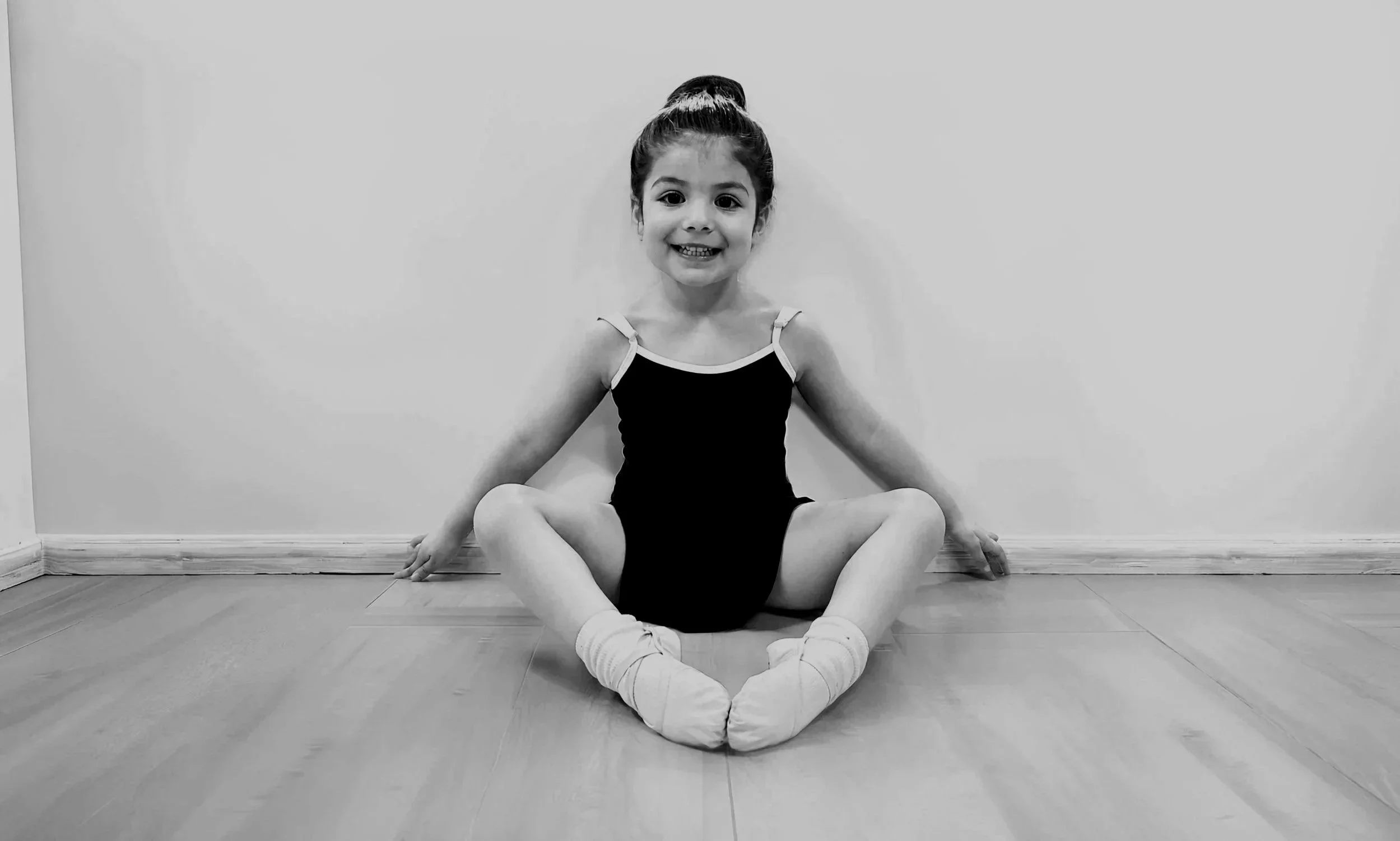 Young ballet student in classical ballet attire at Prefontaine Ballet, a North Vancouver ballet school providing foundational dance training for children from North Vancouver, West Vancouver and Vancouver.