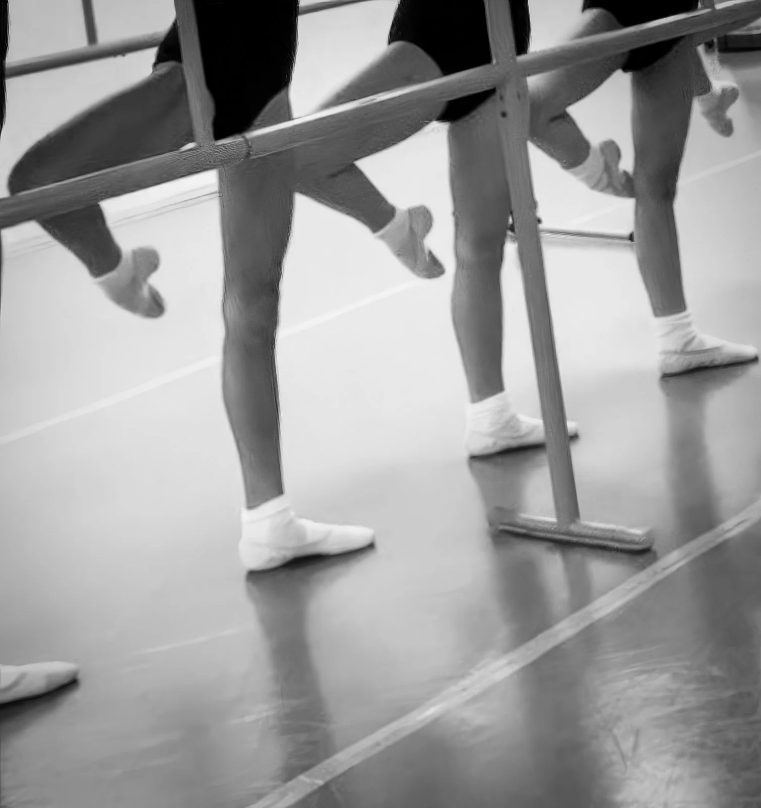 Young ballet students practicing classical barre technique to develop posture, strength, alignment, and musicality at Prefontaine Ballet, serving North Vancouver, West Vancouver, Vancouver, and the North Shore.
