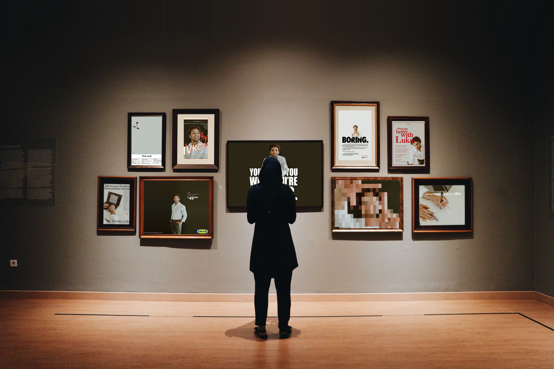 A person dressed in black with a hood stands and looks at framed posters and artwork on a gallery wall. The posters include portraits of a man, text, and advertisements. The campaign is for Luka Ivkovic and is about personal branding. 