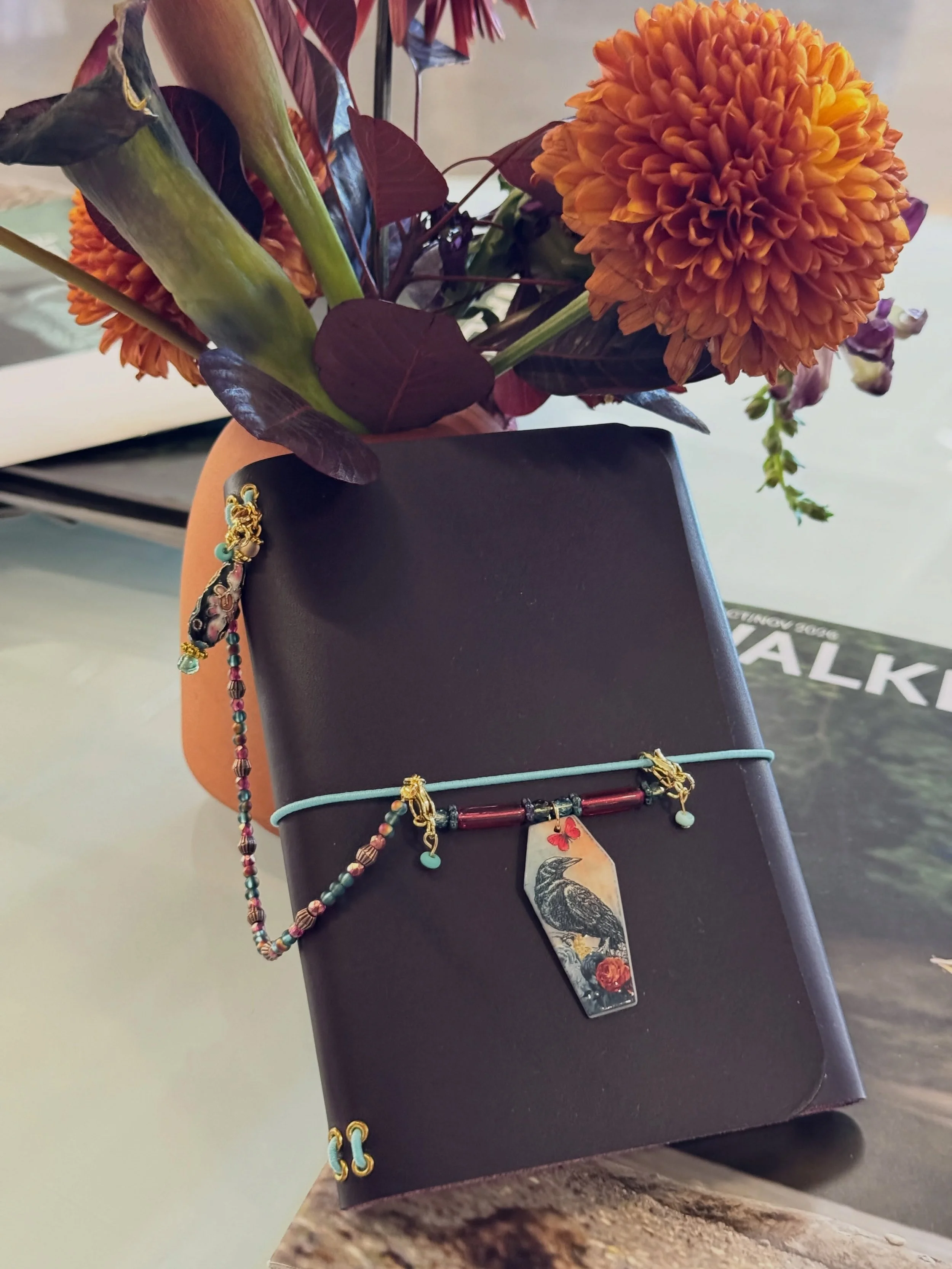 🧡🪐 We are back this Saturday from 9am to 1pm at the incredible @s.k.coffee Vandalia! Our Journal Jewels by Sarah Campbell @slcampbell5 now includes fall and seasonal favorites so swing by if your journal needs a little pick me up! 🐦&zwj;⬛ 🎃 🍁 

