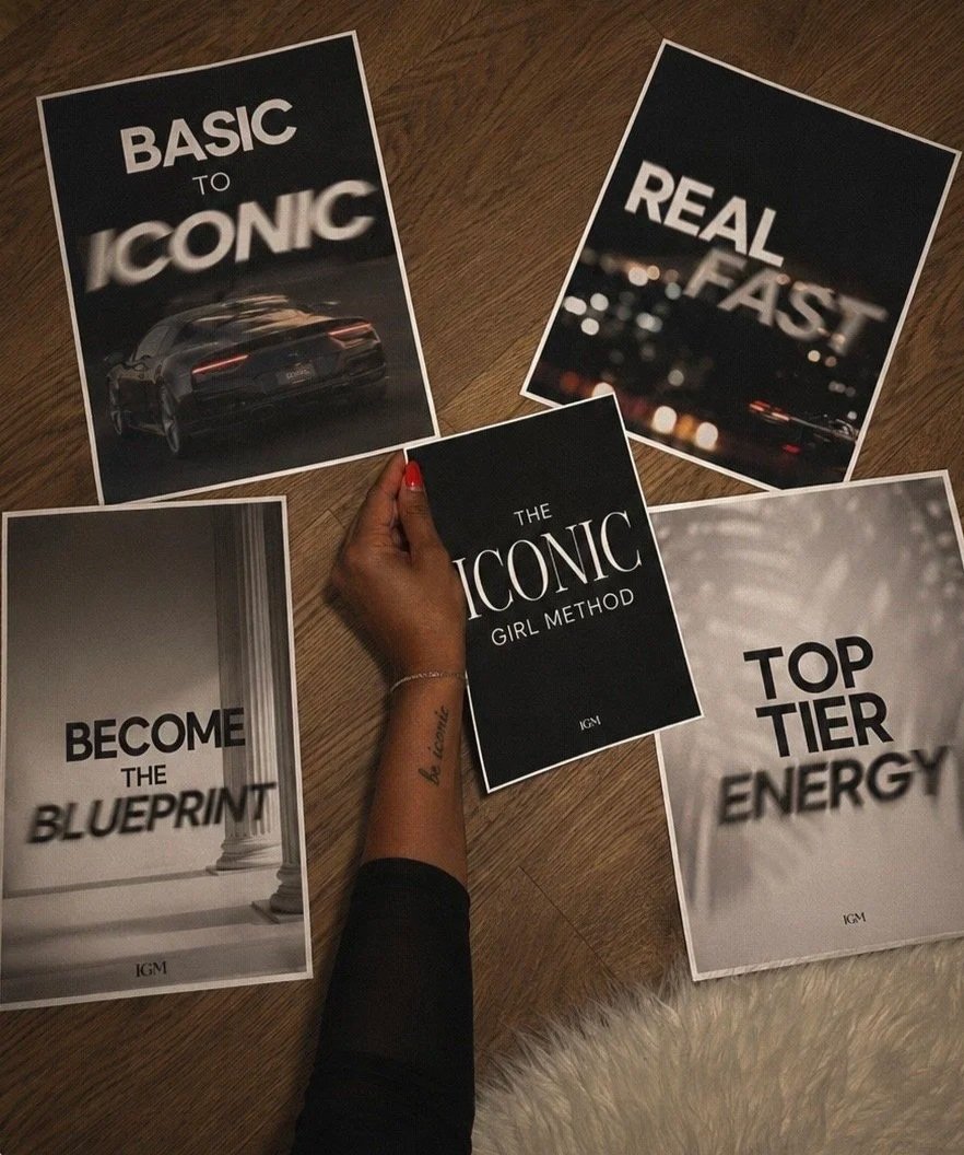 A person holding a book titled "The Iconic Girl Method" surrounded by five posters with motivational phrases: "Basic to Iconic," "Real Fast," "Become the Blueprint," "Top Tier Energy," and one showing a luxury car with the phrase "Basic to Iconic."