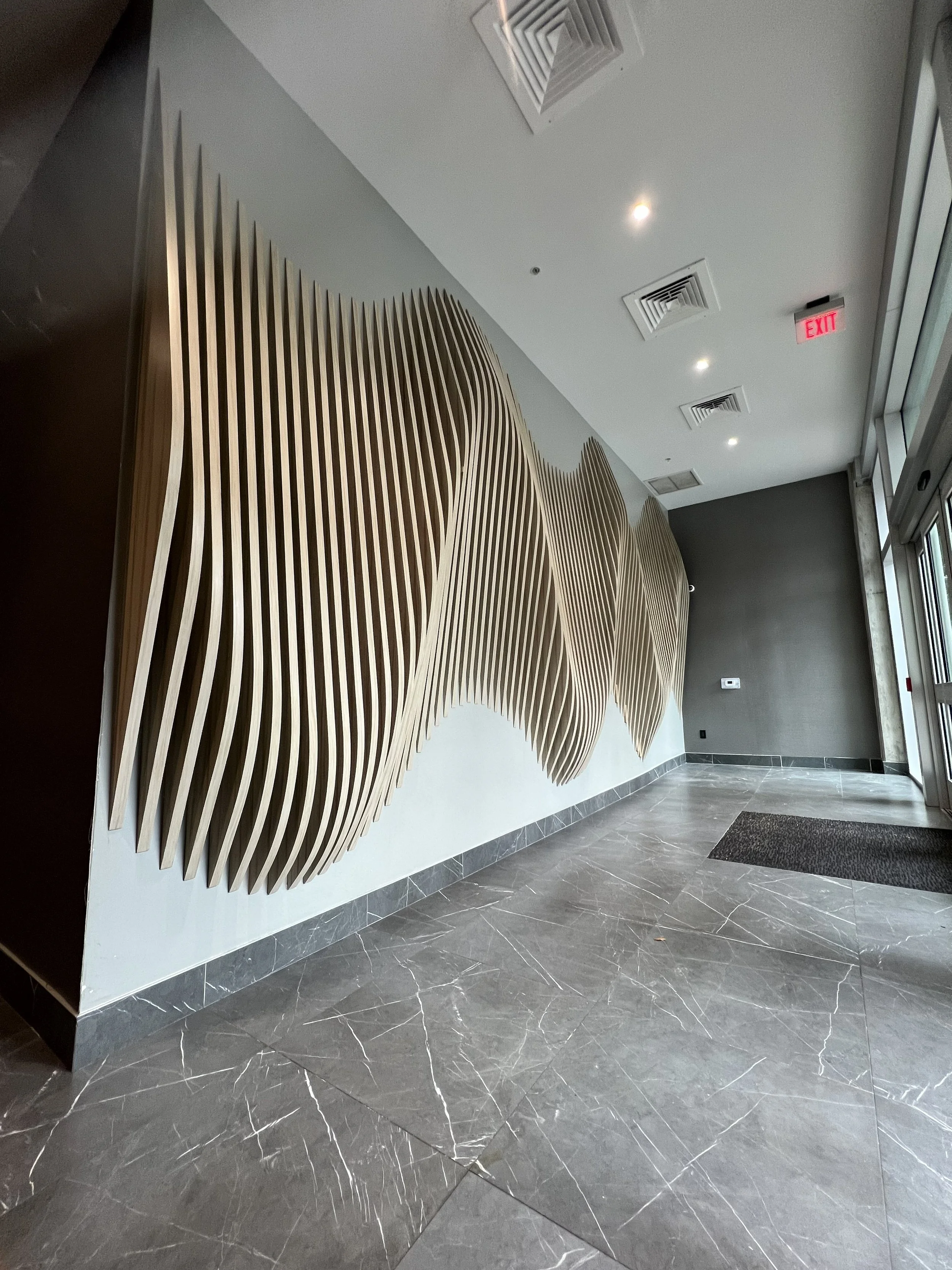 Interior of a building with a modern parametric wall design.