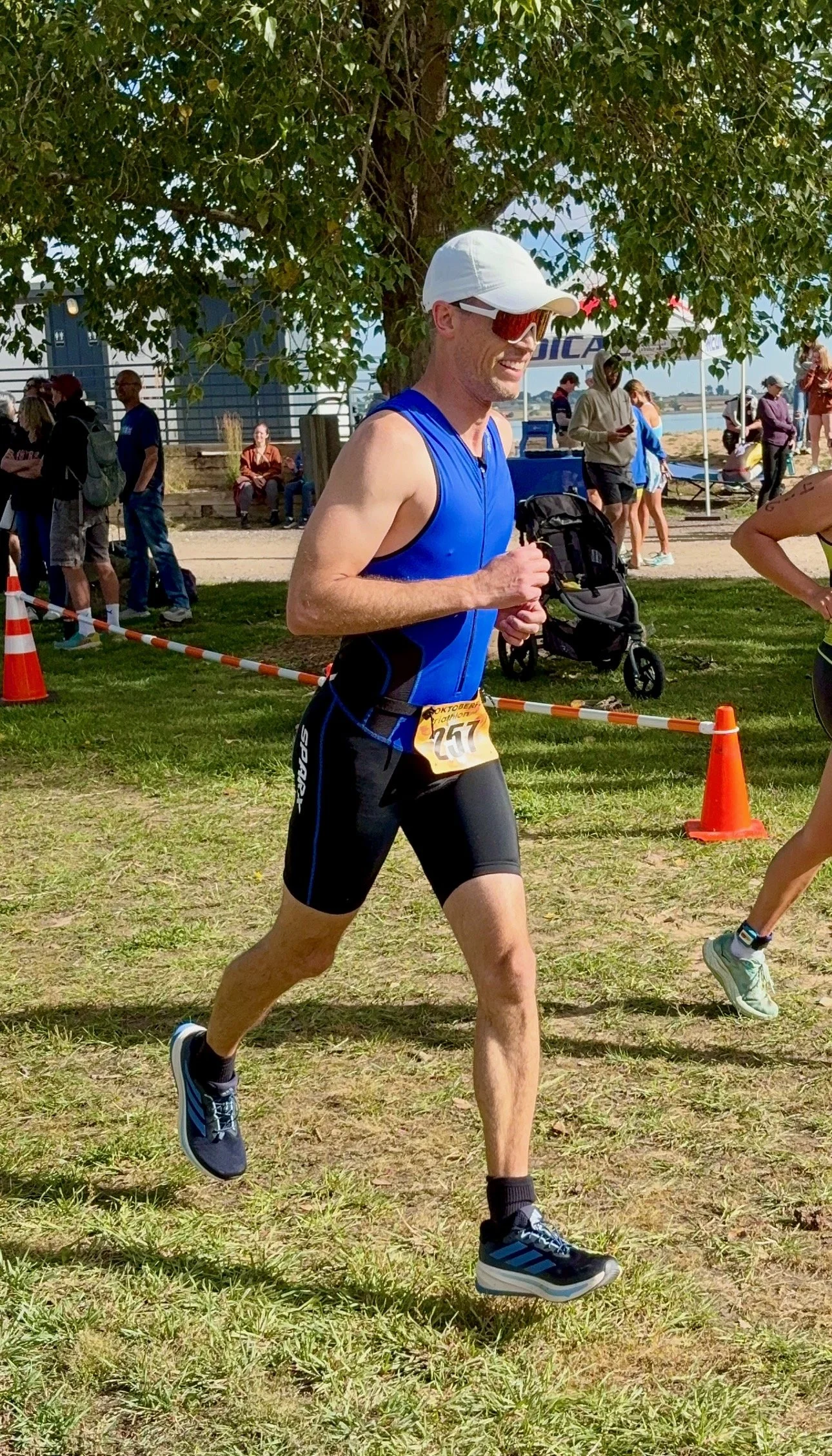 Ron Harder DPT competing in running portion of triathlon at Union Reservoir in Longmont