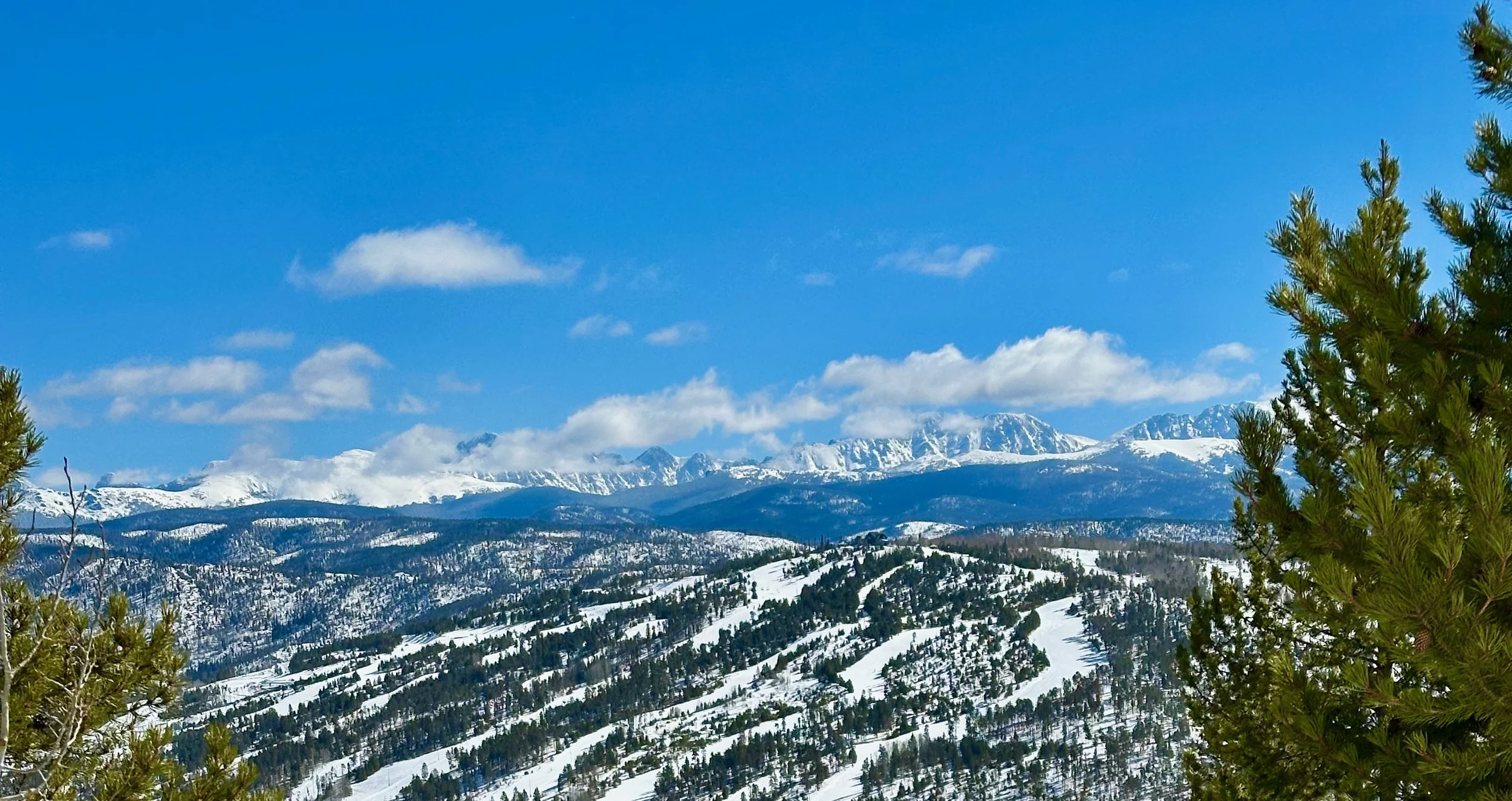 Spring blue sky mountain view of Granby Ranch ski resort