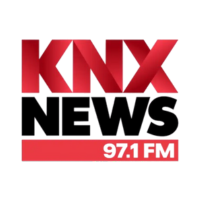Logo for KNX News 92.1 FM with red and black text.