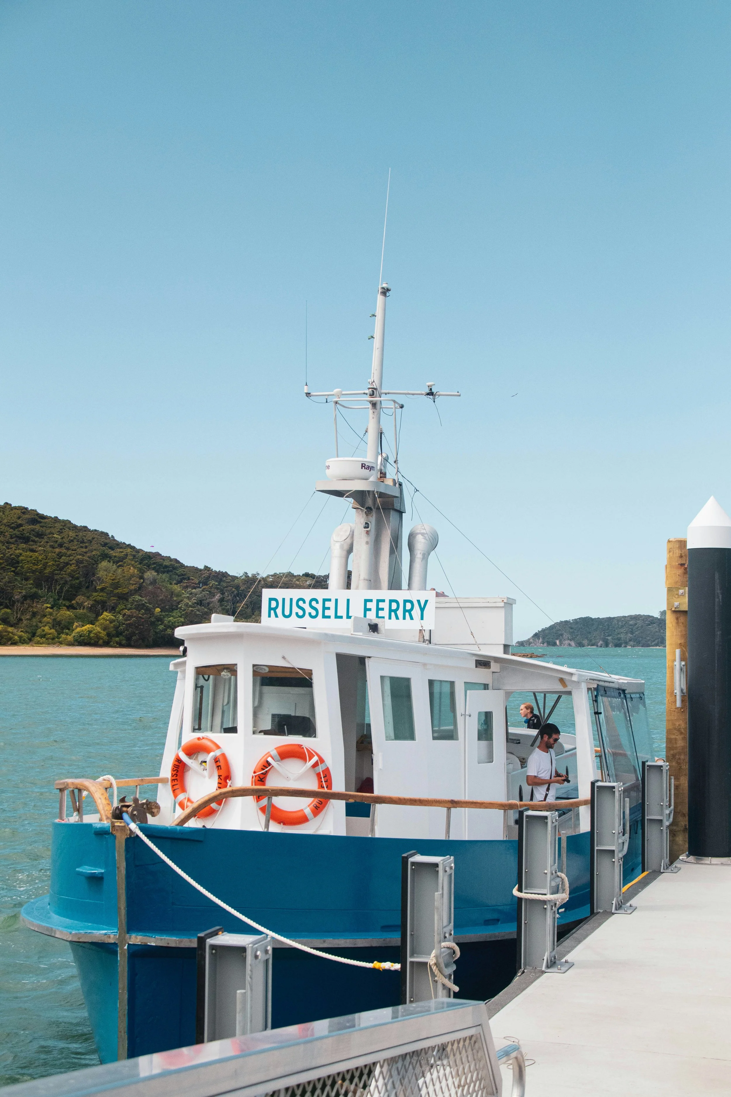 Russell Ferry docked at a pier