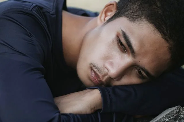 man laying on his arms