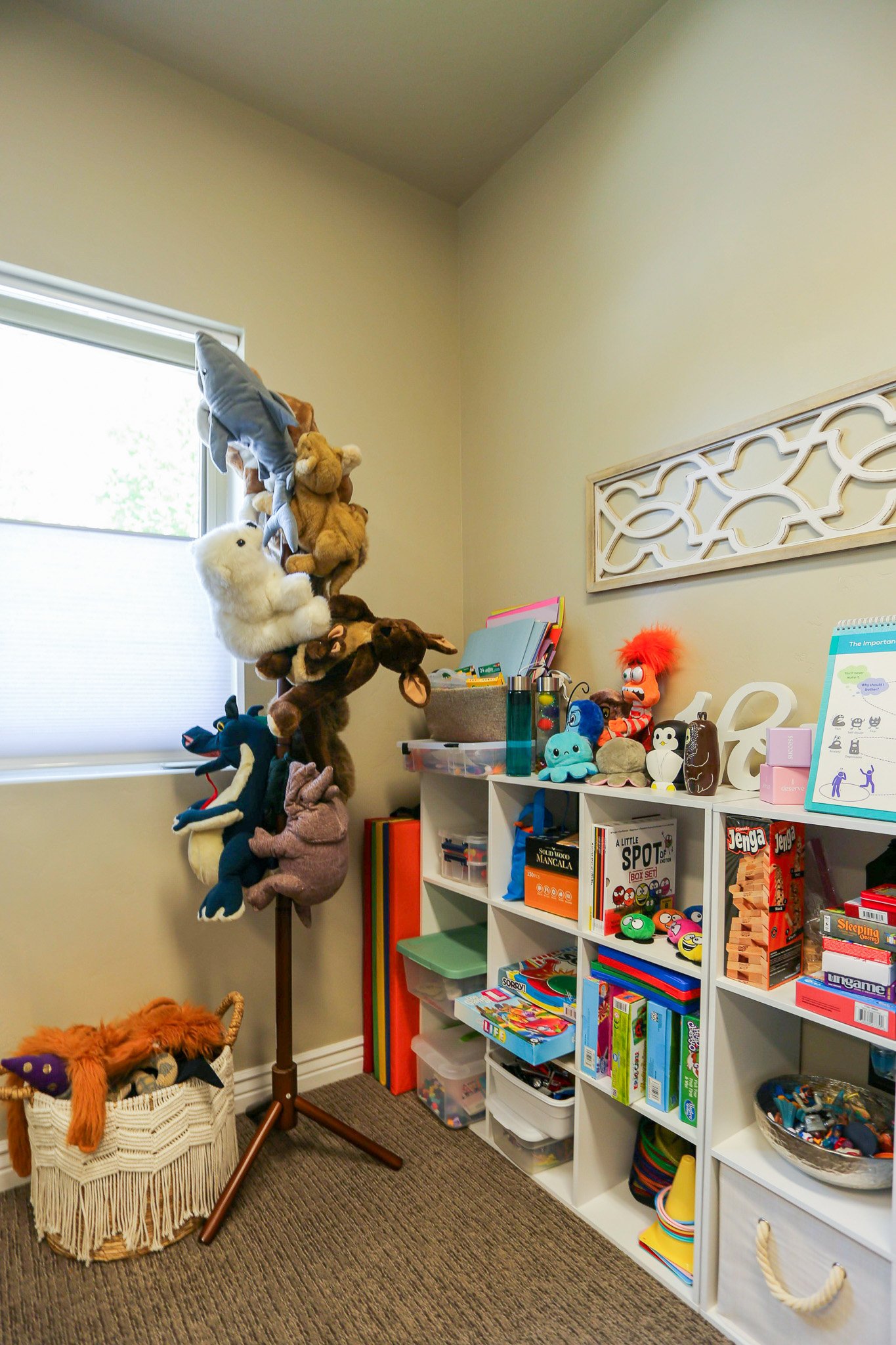 A collection of puppets, books, and therapy tools designed for children's therapy