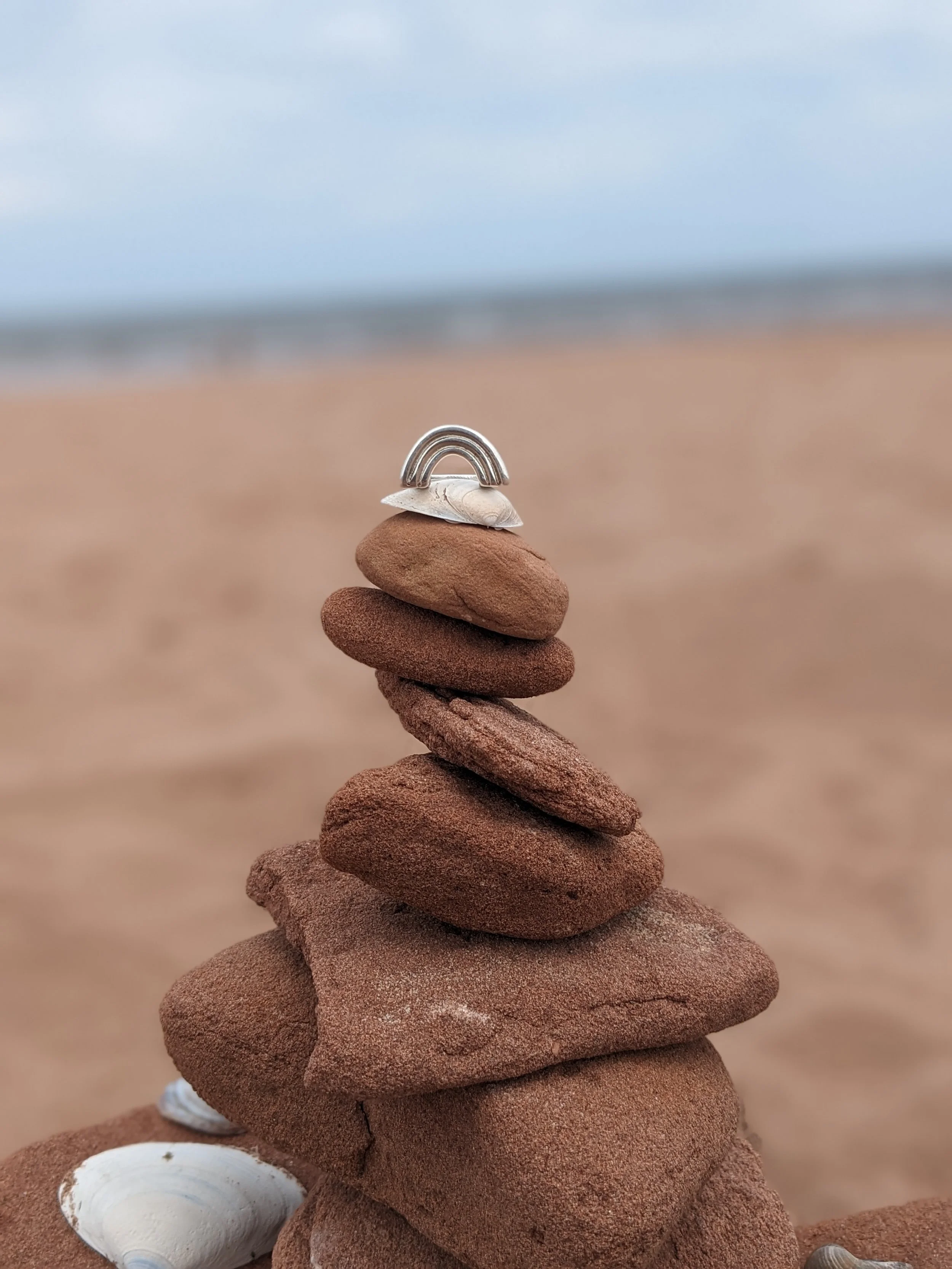 PXL_rainbow stacked rocks20250711_170139293.PORTRAIT.jpg