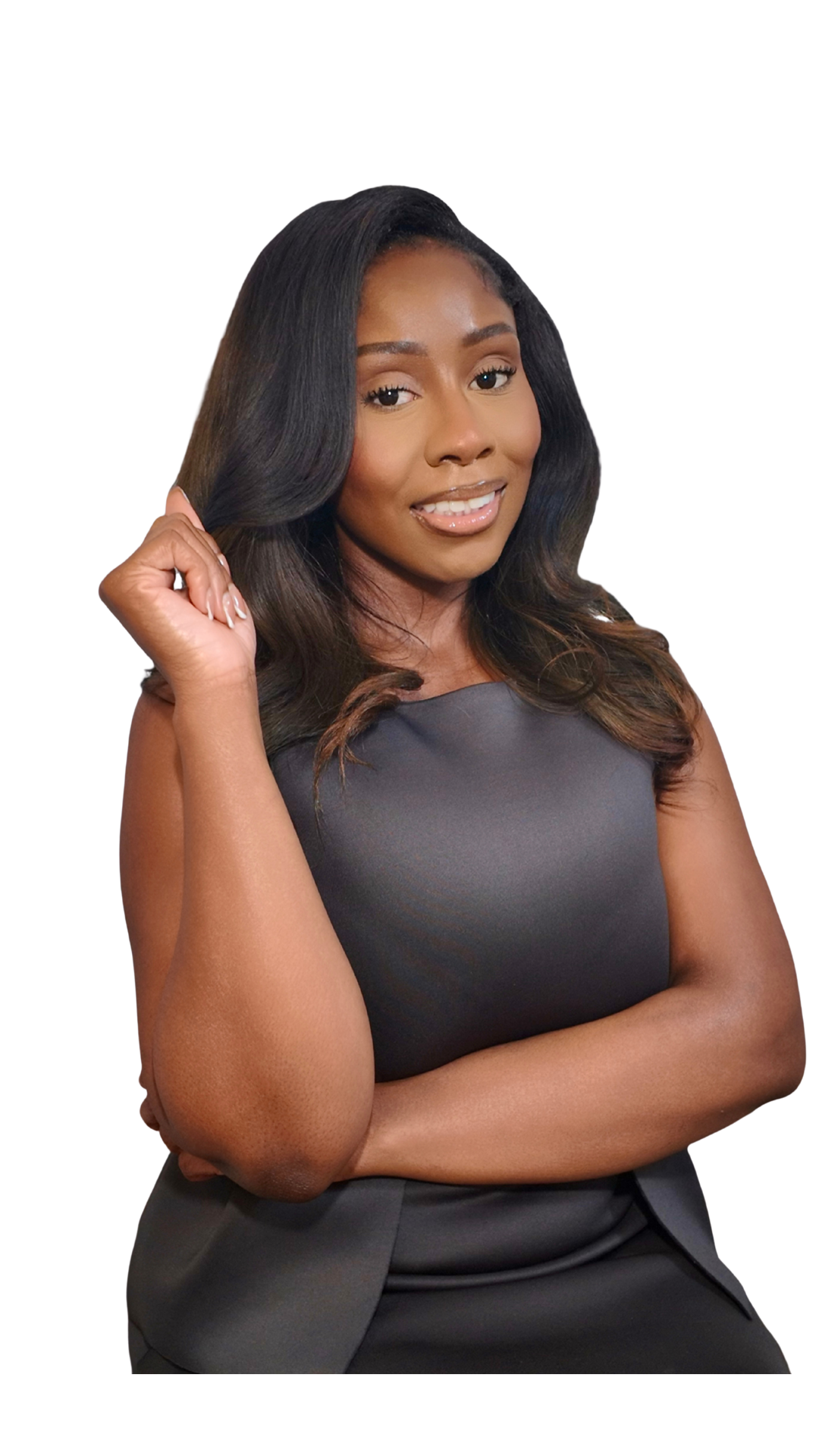 A woman with dark, wavy hair, wearing a sleeveless black dress, smiling and posing with her arm crossed and one hand touching her hair.