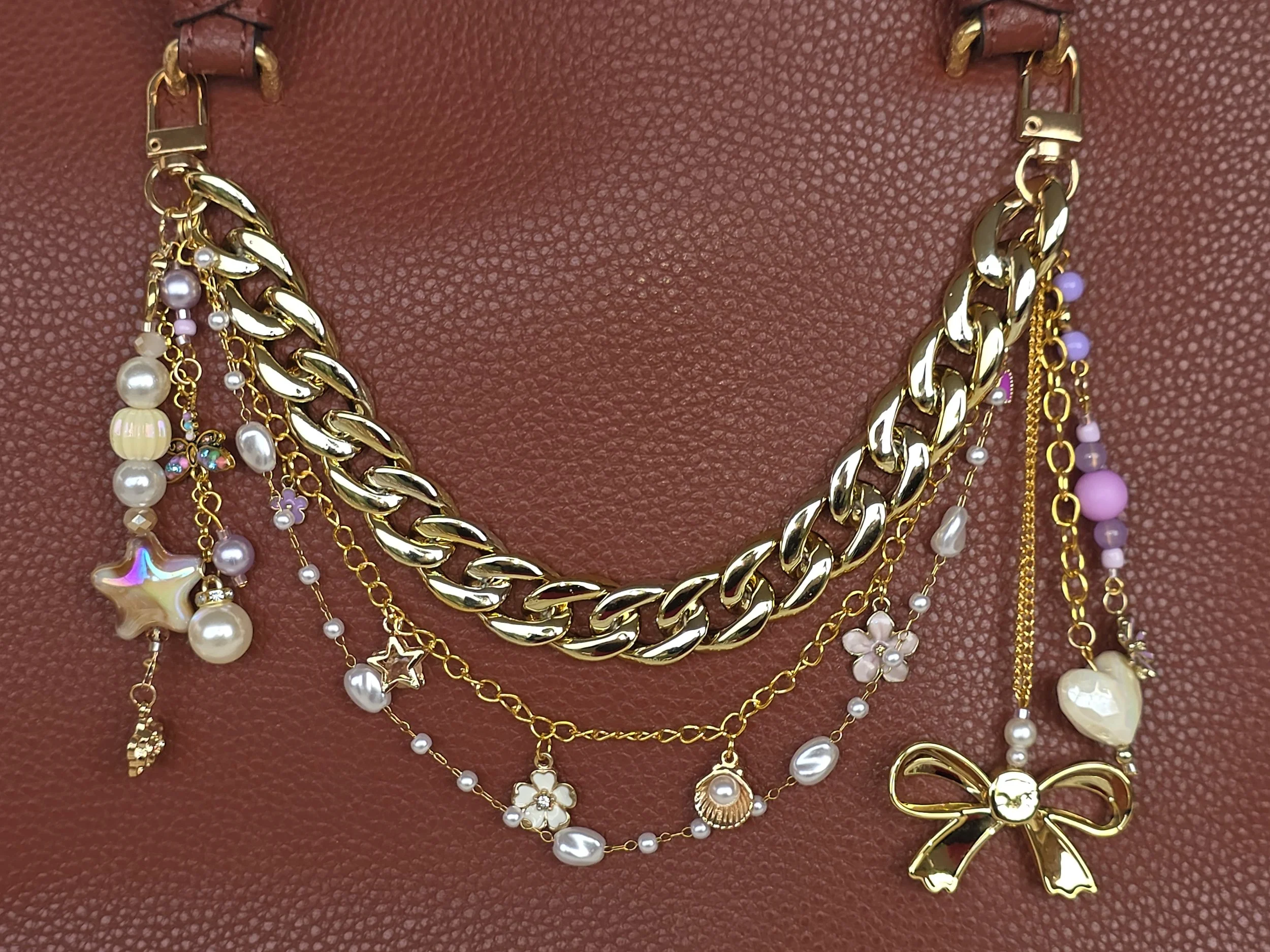 Gold bag chain with lilac enamel flower charms, pearls and large acrylic bow — The Wisteria Hoard by Charm & Delight