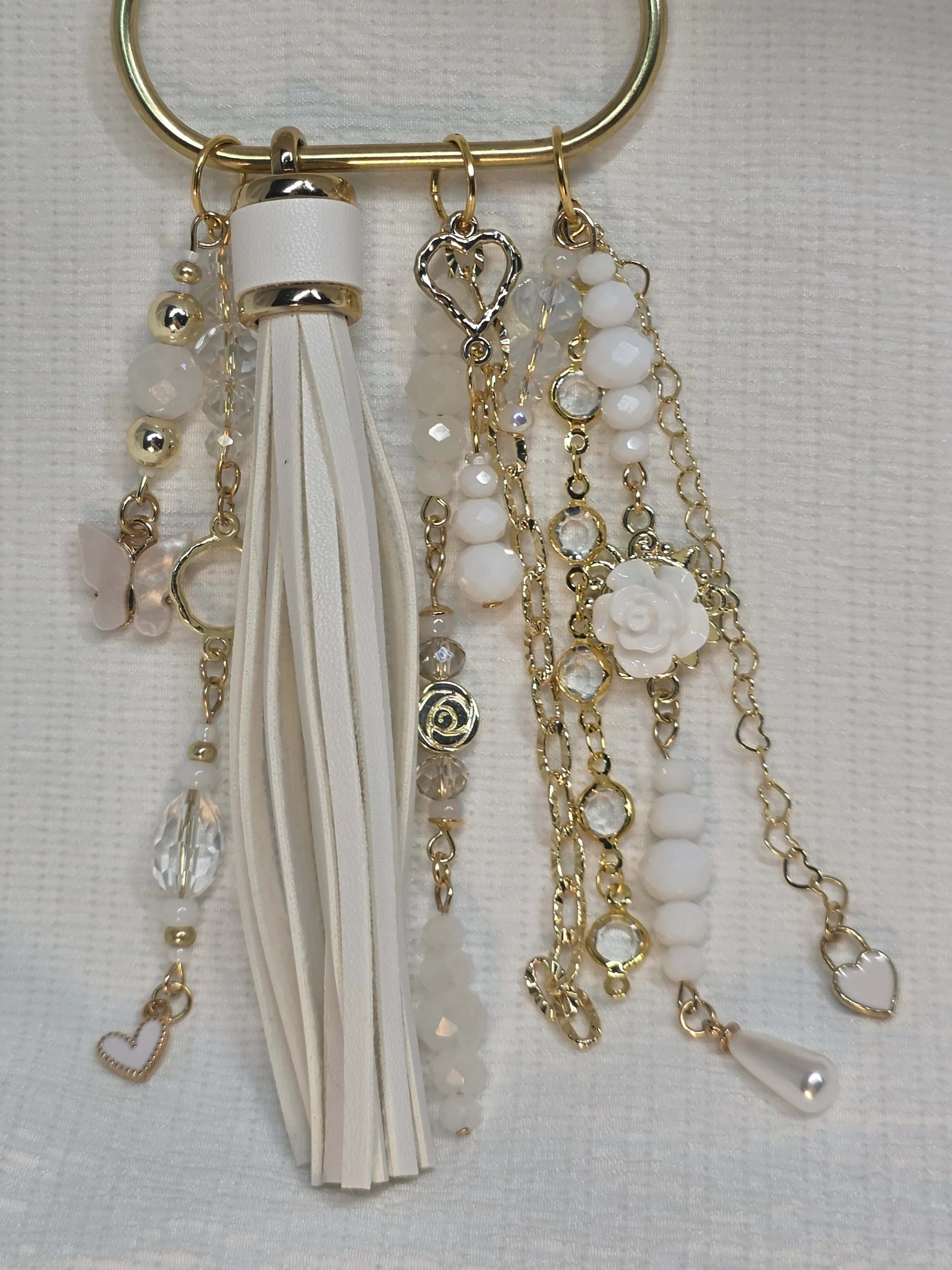White and gold handmade bag charm with opalite beads, butterfly charm and PU leather tassel — The Margot by Charm & Delight