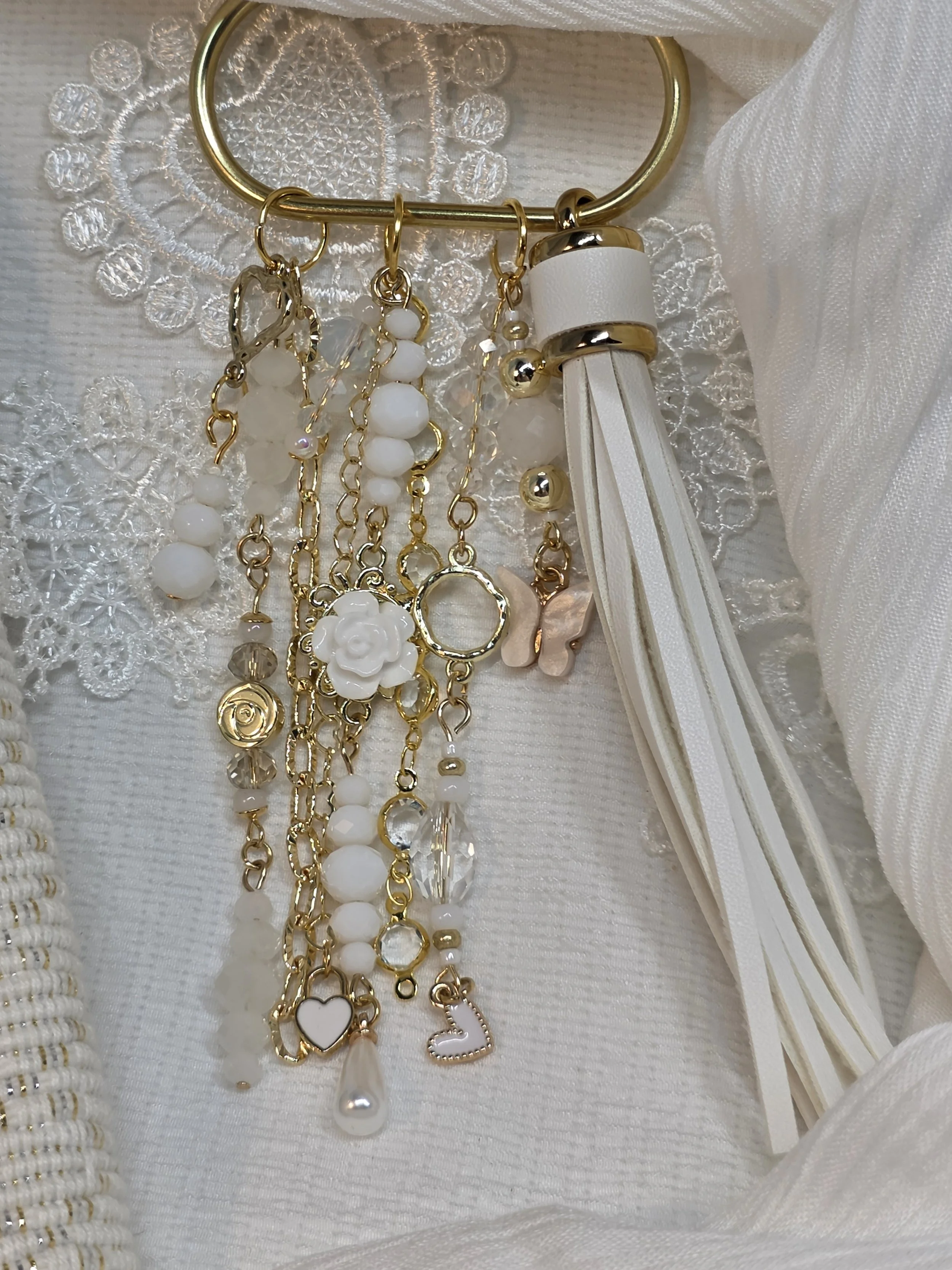 White and gold handmade bag charm with opalite beads, butterfly charm and leather tassel — The Margot by Charm & Delight