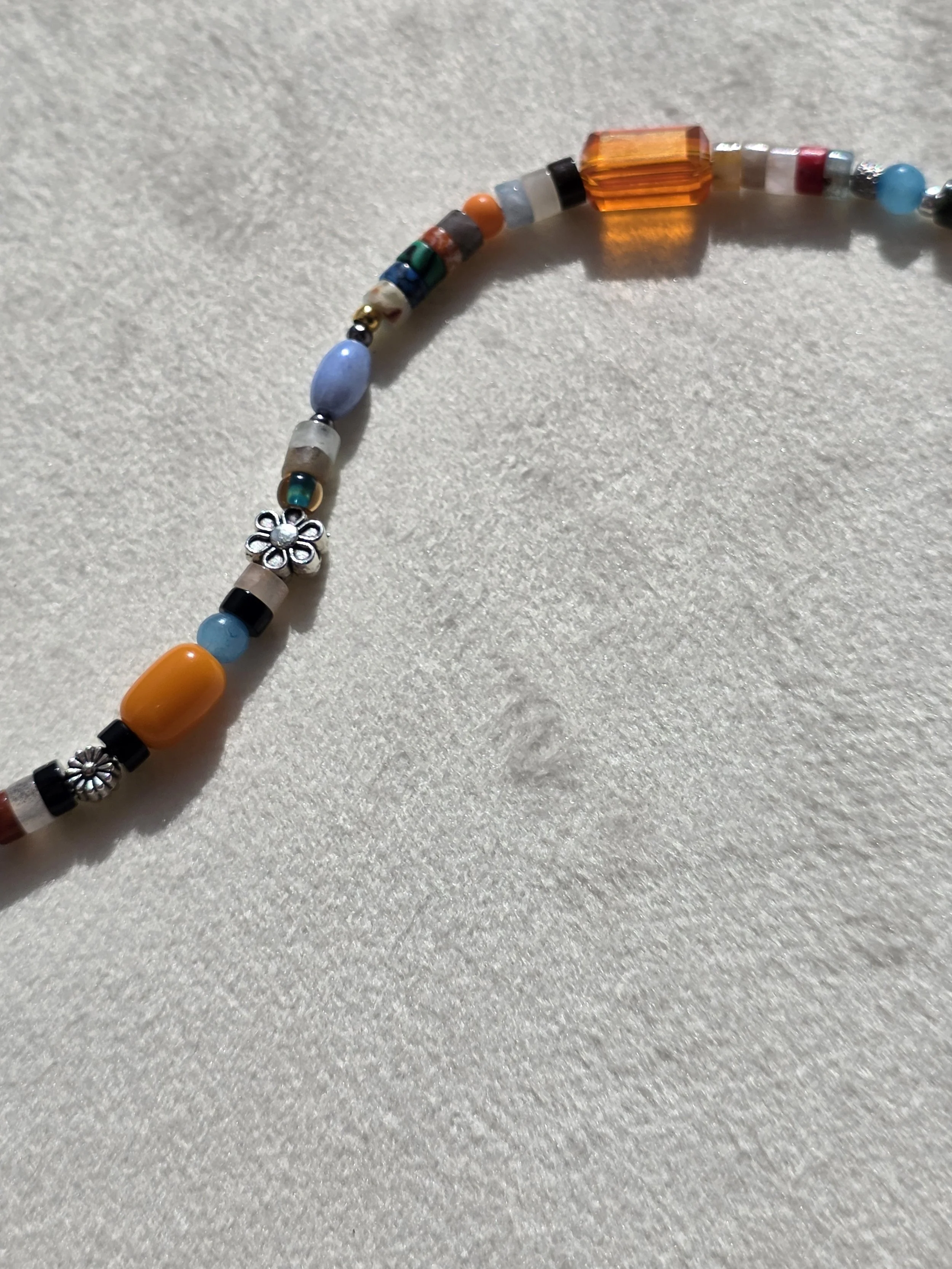 Close-up of beading on The Wanderer gemstone heishi necklace