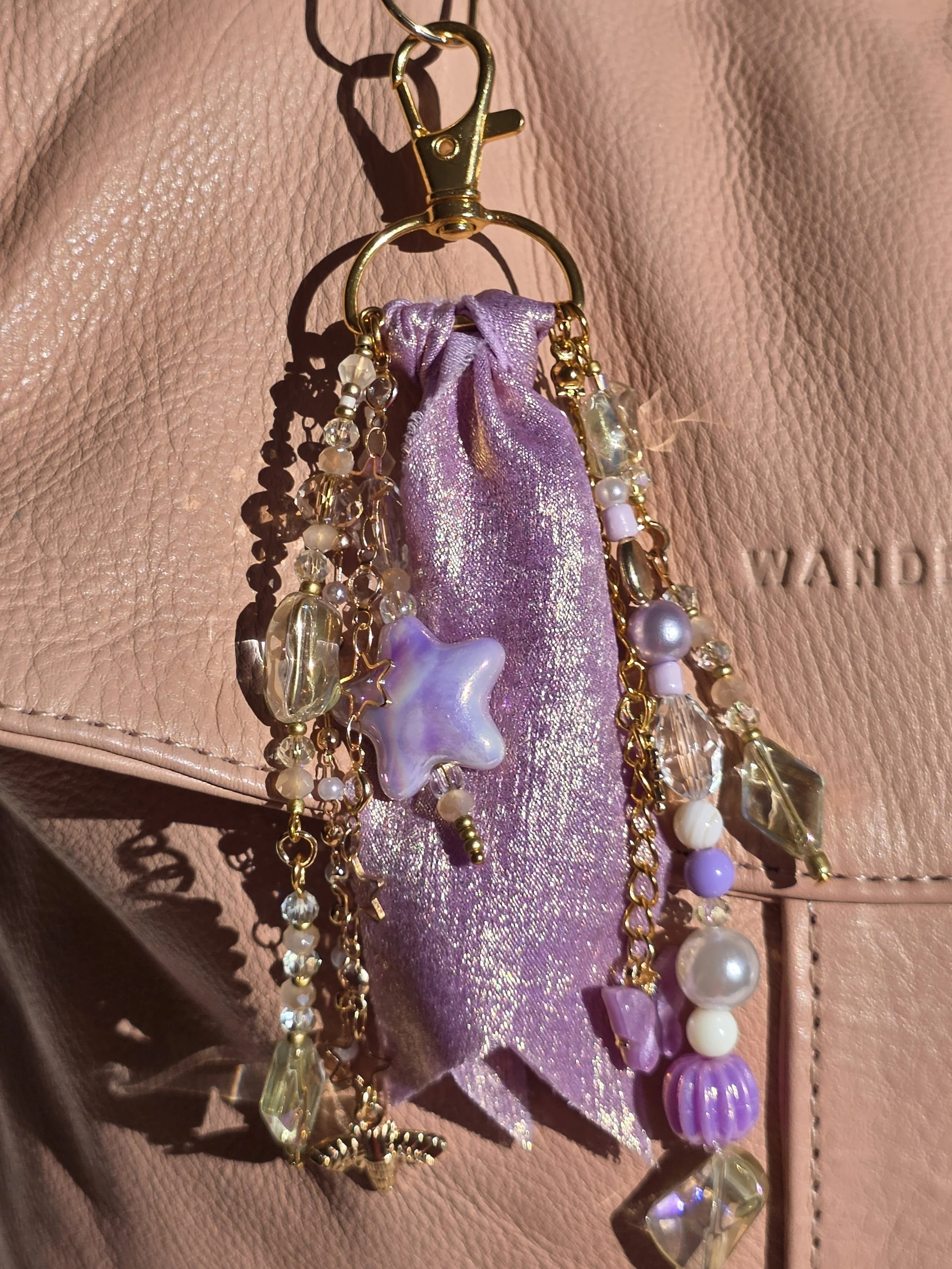 Purple and gold hand made bag charm. The Aurelian by Charm & Delight