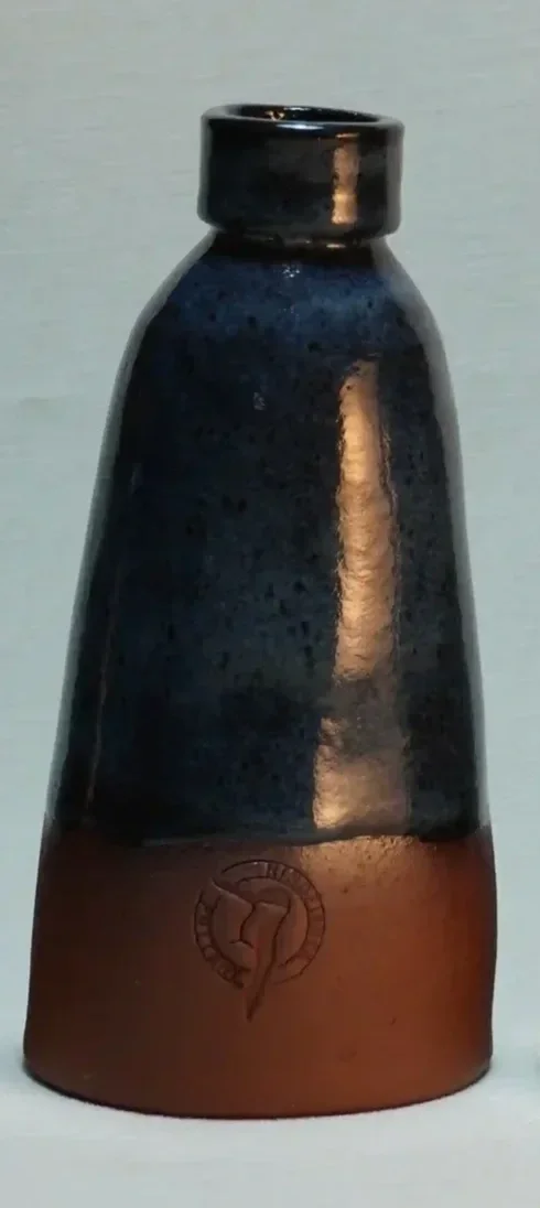 A small ceramic vase with a dark blue upper glazed section and a terracotta brown lower section, featuring the KINGFISHER POTTERY logo on the front.